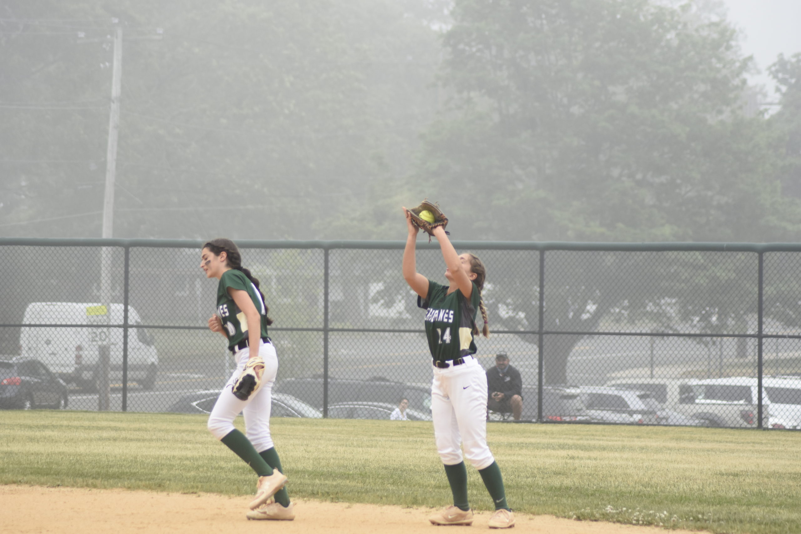 Westhampton Beach second baseman Elana Seltzer squeezes a pop fly in her mitt for an out.