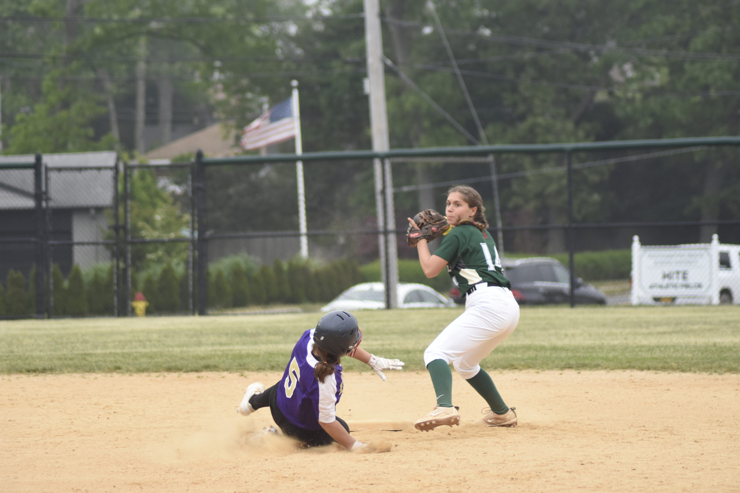 Westhampton Beach senior second baseman Elana Seltzer turns the back end of a double play, one of two in the game for the Hurricanes.