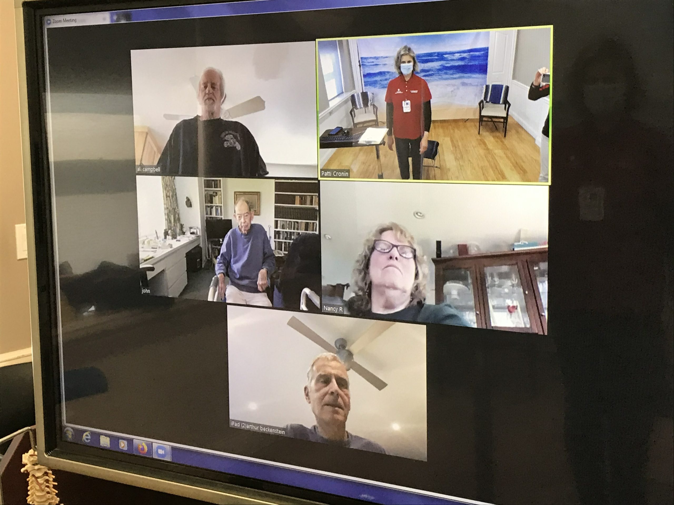 Clinical Exercise Physiologist Ann Welker leads cardiopulmonary rehab patients, clockwise from left to right, Al Campbell, Nancy Roesler, Arthur Beckenstein and John Griffith through a Zoom session.