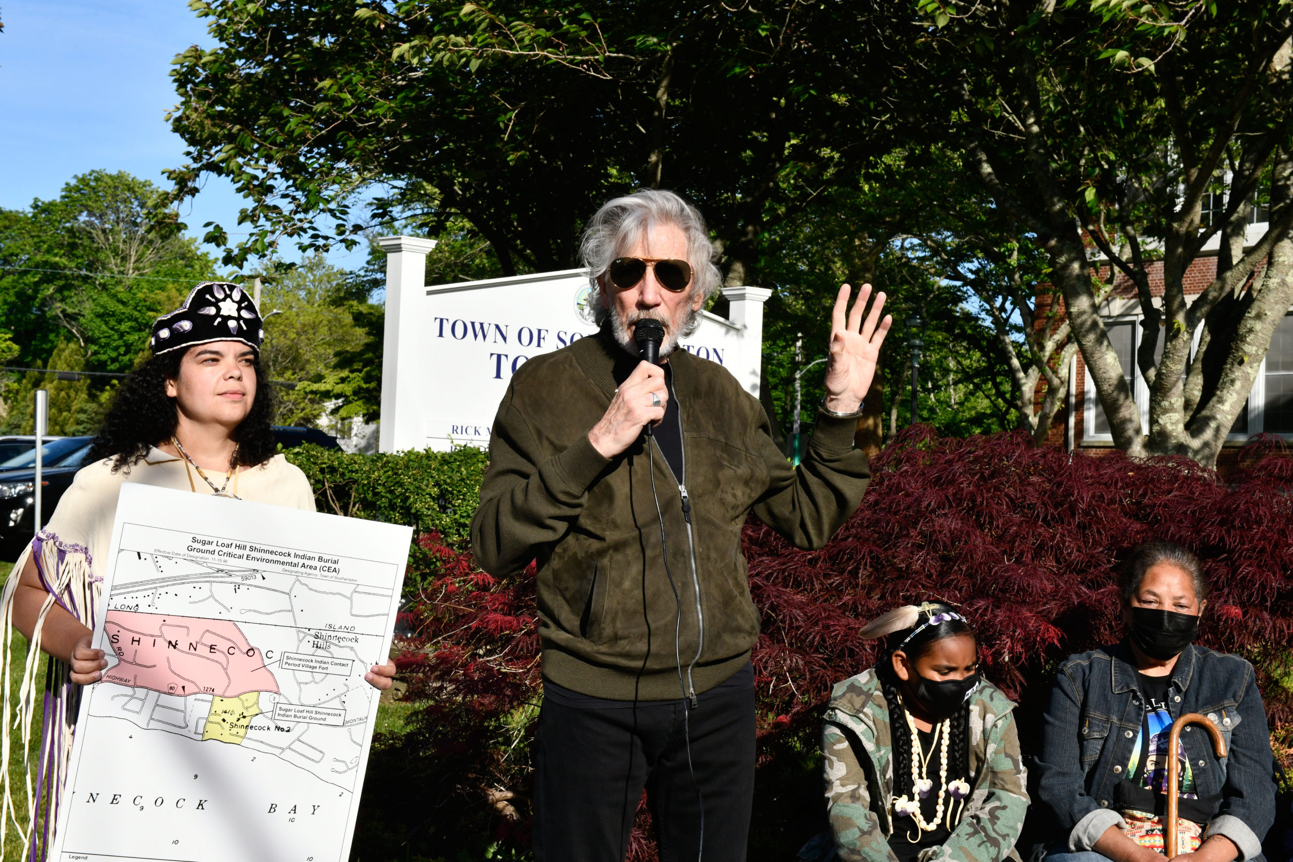 Roger Waters speaks in front of Southampton Town Hall on Tuesday evening prior to the meeting as Tela Troge, left and Rebecca Genia, right, look on.    DANA SHAW