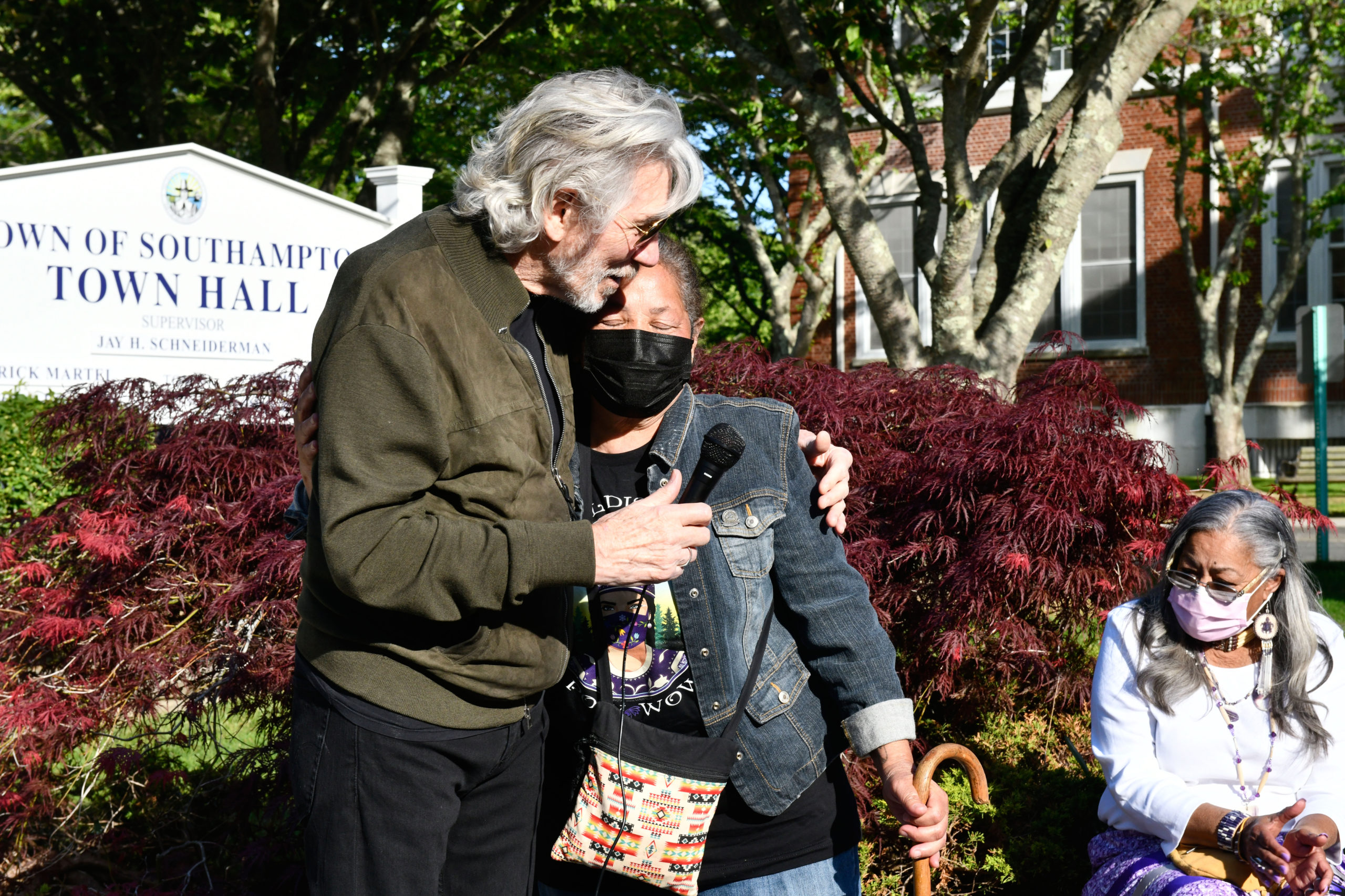 Roger Waters hugs Rebecca Genia at a rally in front of Southampton Town Hall on Tuesday evening.    DANA SHAW