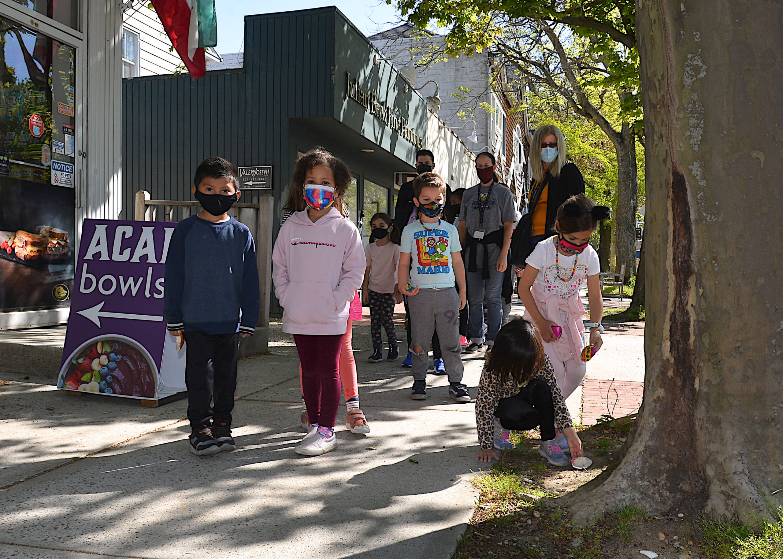 Bridgehampton students in Gabrielle Lemon and Caitlin Hansen’s kindergarten class, accompanied by children from several other grades, strolled into the village to spread a little good cheer on Friday by placing 