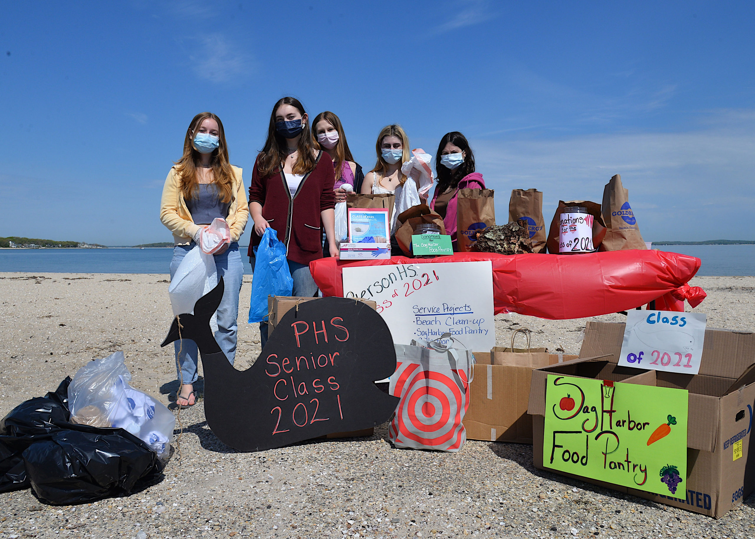Pierson seniors Francesca Vitale, Jamie Farnam, Tess Norris, Sarah Van Houten and Emily Brownstein at Long Beach on Sunday morning for beach clean up and food pantry donations.  KYRIL BROMLEY