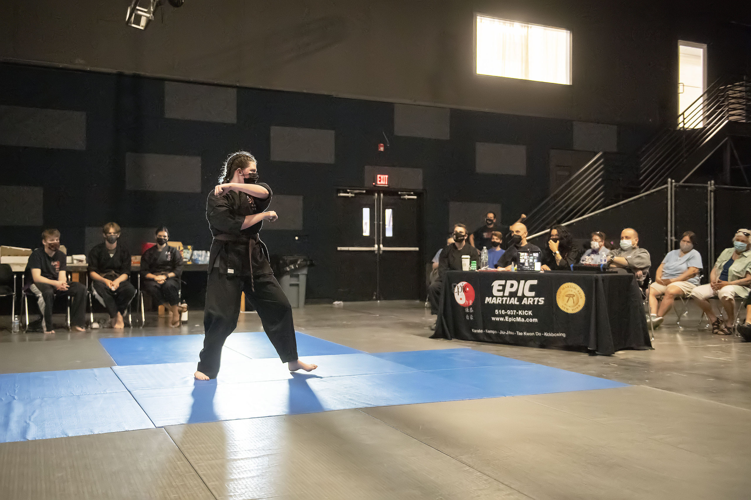 EPIC Martial Arts brown belt student Emily Glass performs a series of skills before a panel of six black belts in order to receive her own promotion to black belt during a ceremony at LTV studios in Wainscott on Sunday.