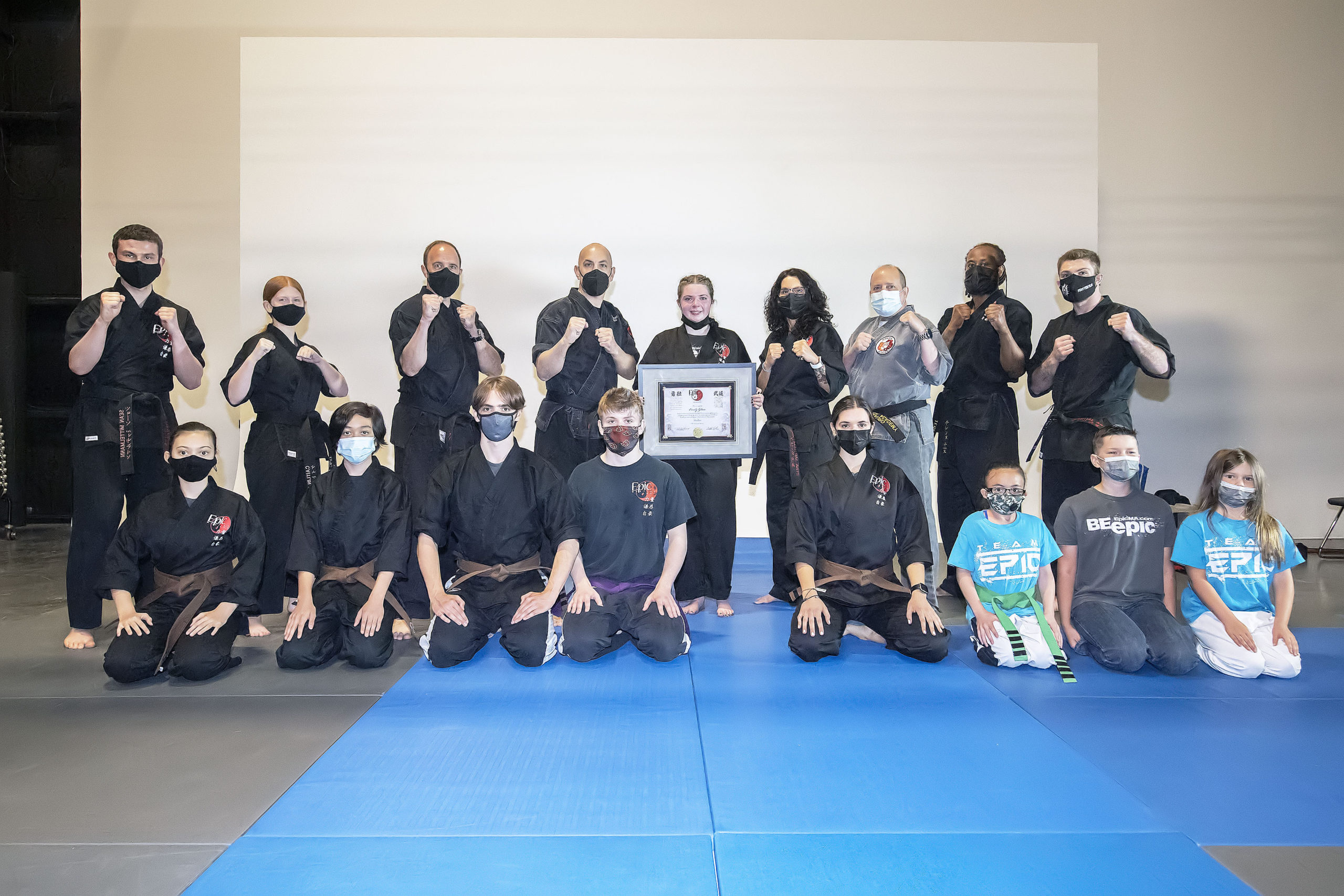 Emily Glass with instructors and other members of EPIC Martial Arts.