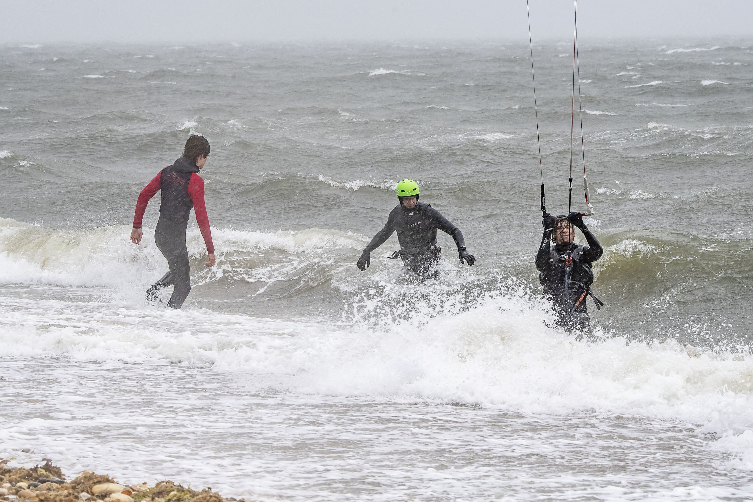 Members of the East Hampton Ocean Rescue Team used a jetski and sled to help with rescuing two kiteboarders who were caught out in the gale-force winds and rough waters east of Gerard Drive in Springs.