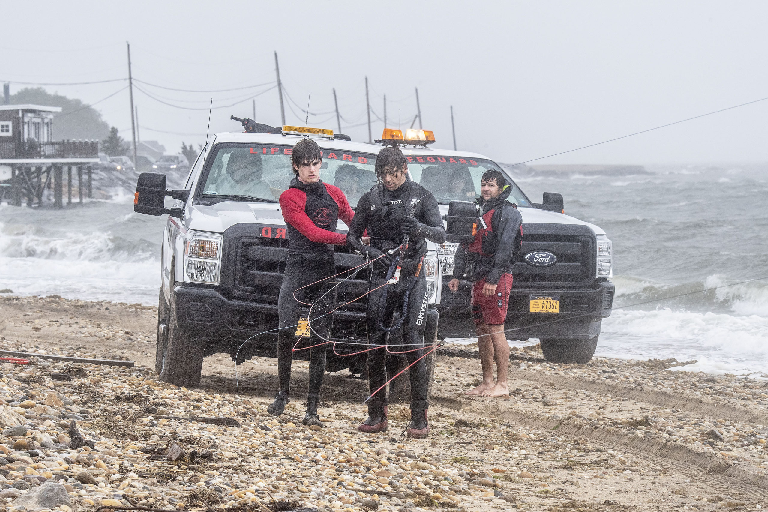 Members of the East Hampton Ocean Rescue Team used a jetski and sled to help with rescuing two kiteboarders who were caught out in the gale-force winds and rough waters east of Gerard Drive in Springs.