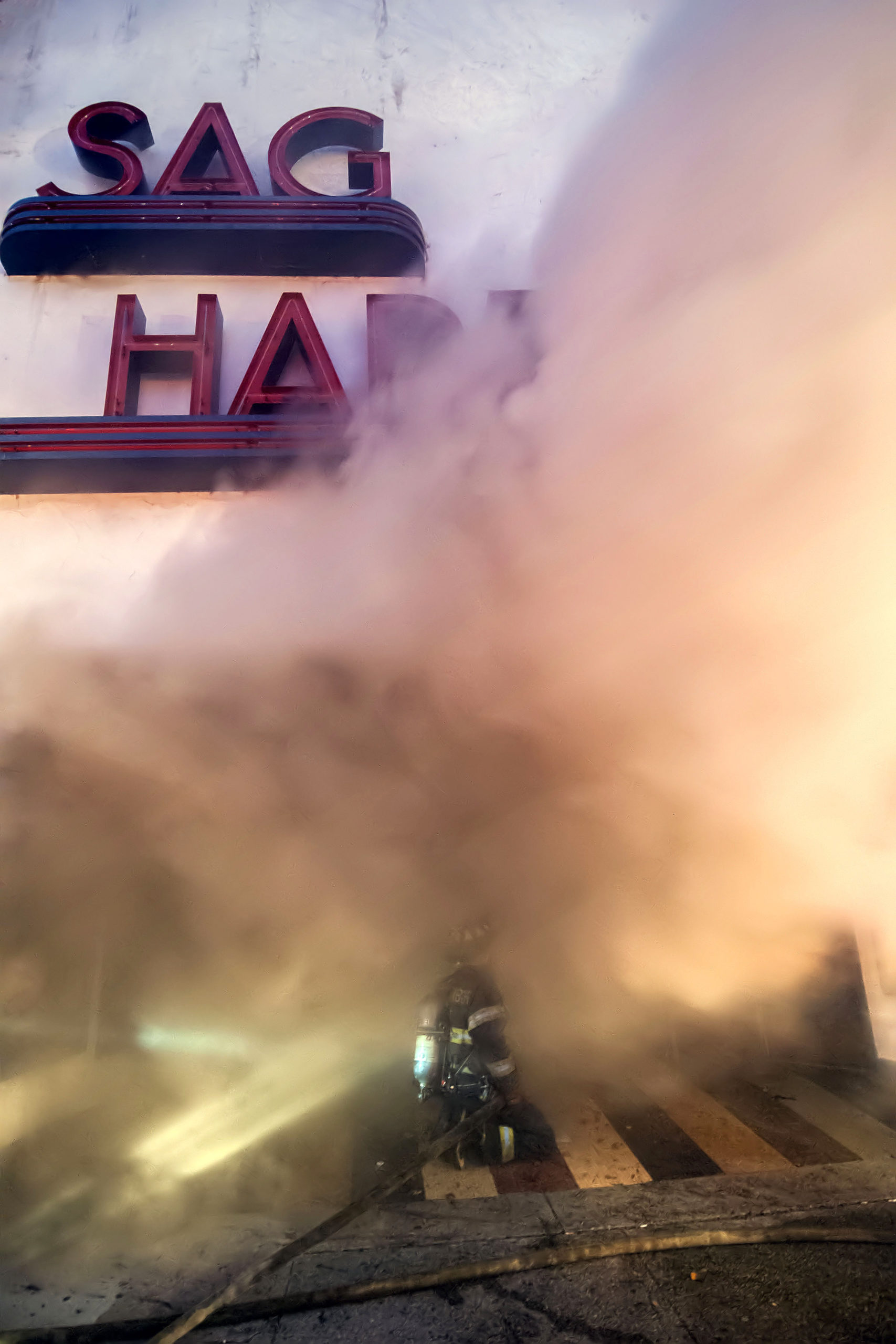 Smoke pours from the Sag Harbor Cinema fire on December 16, 2016.