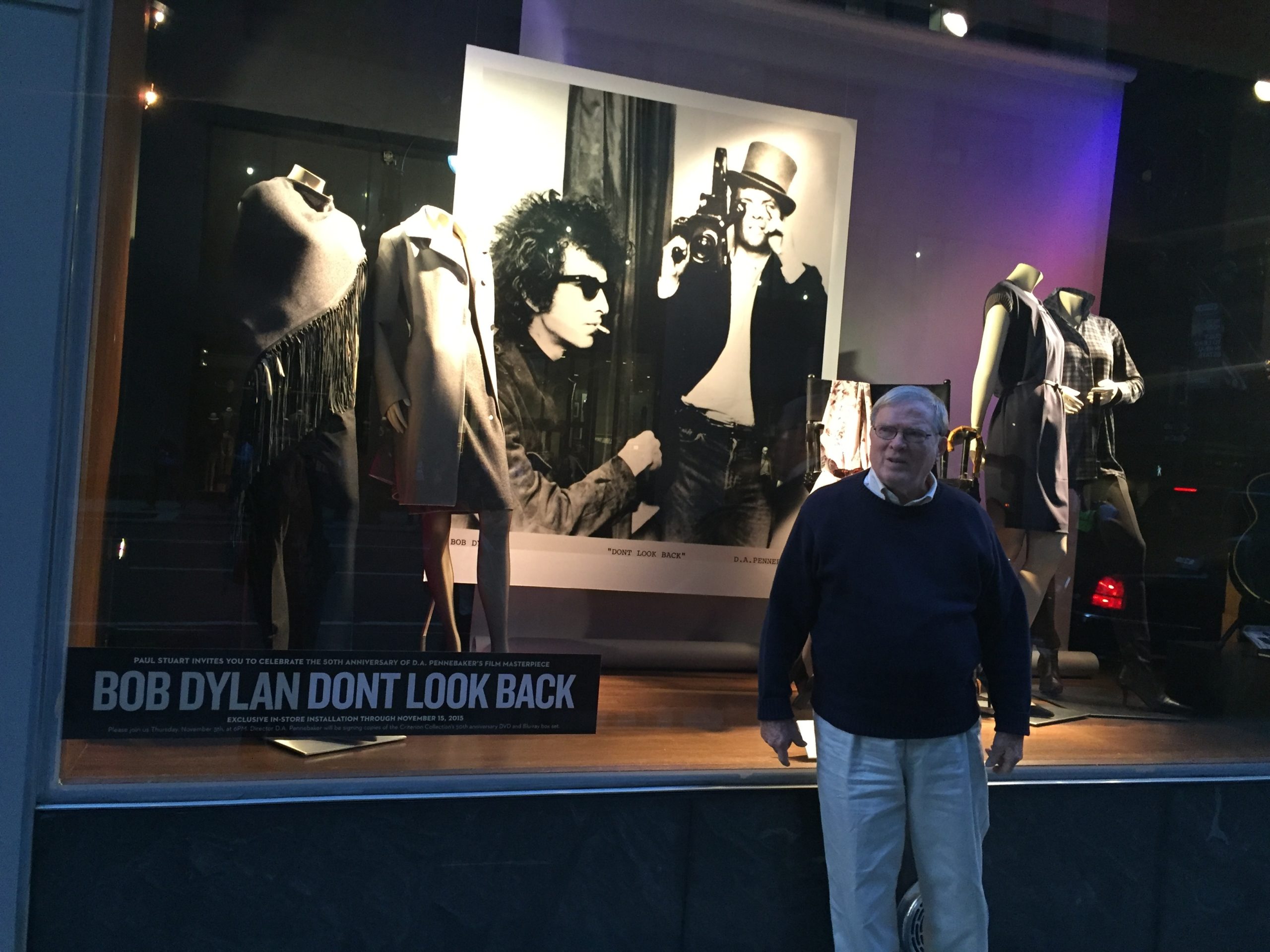 D.A. Pennebaker in front of the Paul Stuart store window on Madison Ave featuring Joseph's Baldassare's first Bob Dylan photo exhibition.