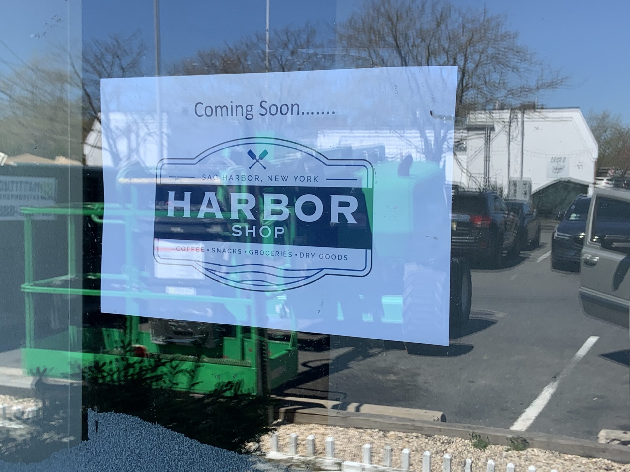 Signs announce the arrival of a new convenience store in the space formerly occupied by 7-Eleven in Sag Harbor.  STEPHEN J. KOTZ