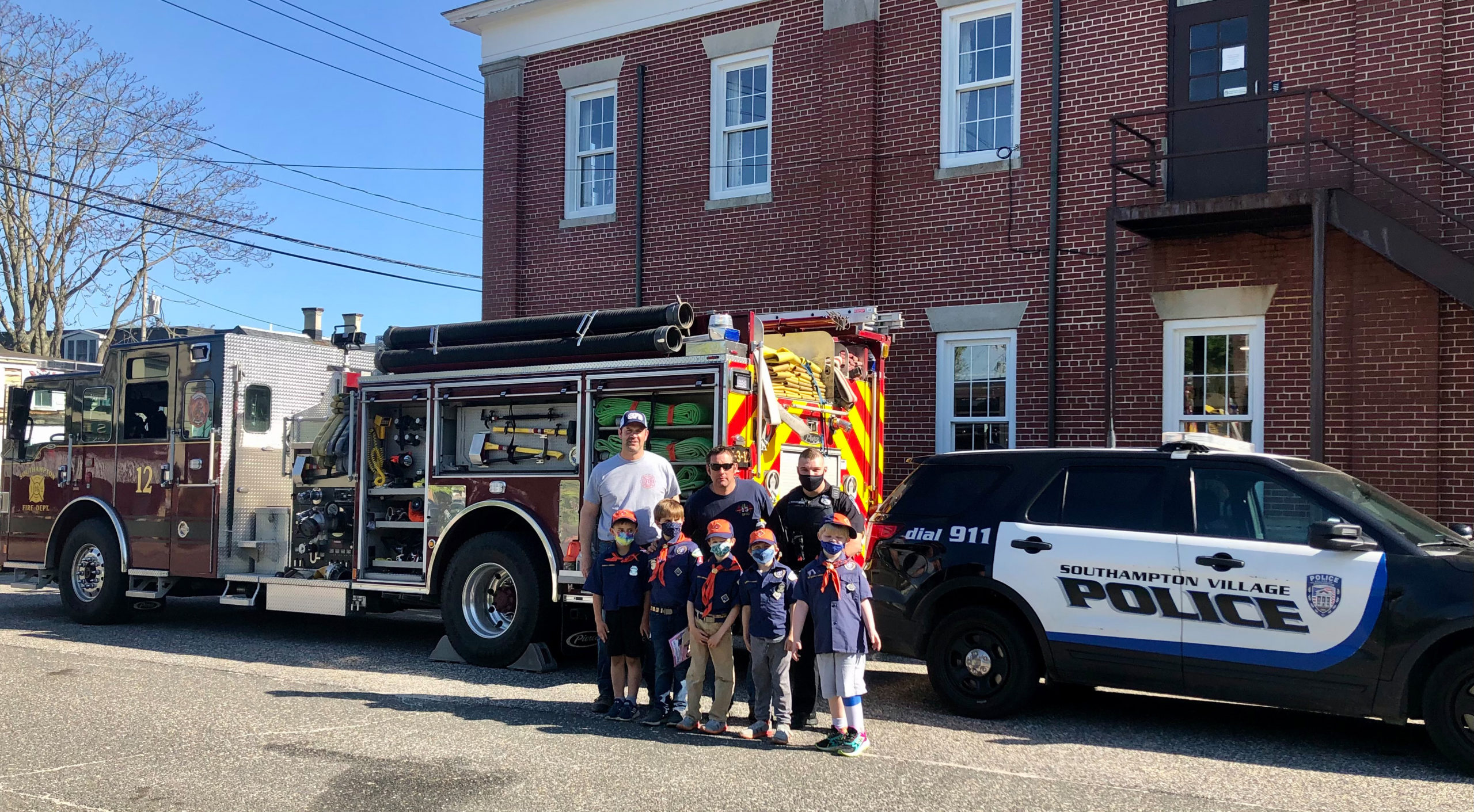Cub Scout Pack 14 Tiger Den visited with members of Southampton Fire Department, Southampton Village Volunteer Ambulance, and Southampton Village Police Department on Friday to learn about the emergency services and earn the Tiger Safe and Smart achievement.
Back row, left to right, Chris Capalbo, Gene Squires and Kyle McGuiness. Front row, left to right,  JT Ingram, Thomas Capalbo, Desmond O’Leary, Cole D’Italia and Tavin Tietjen.            COURTESY CHRIS CAPALBO