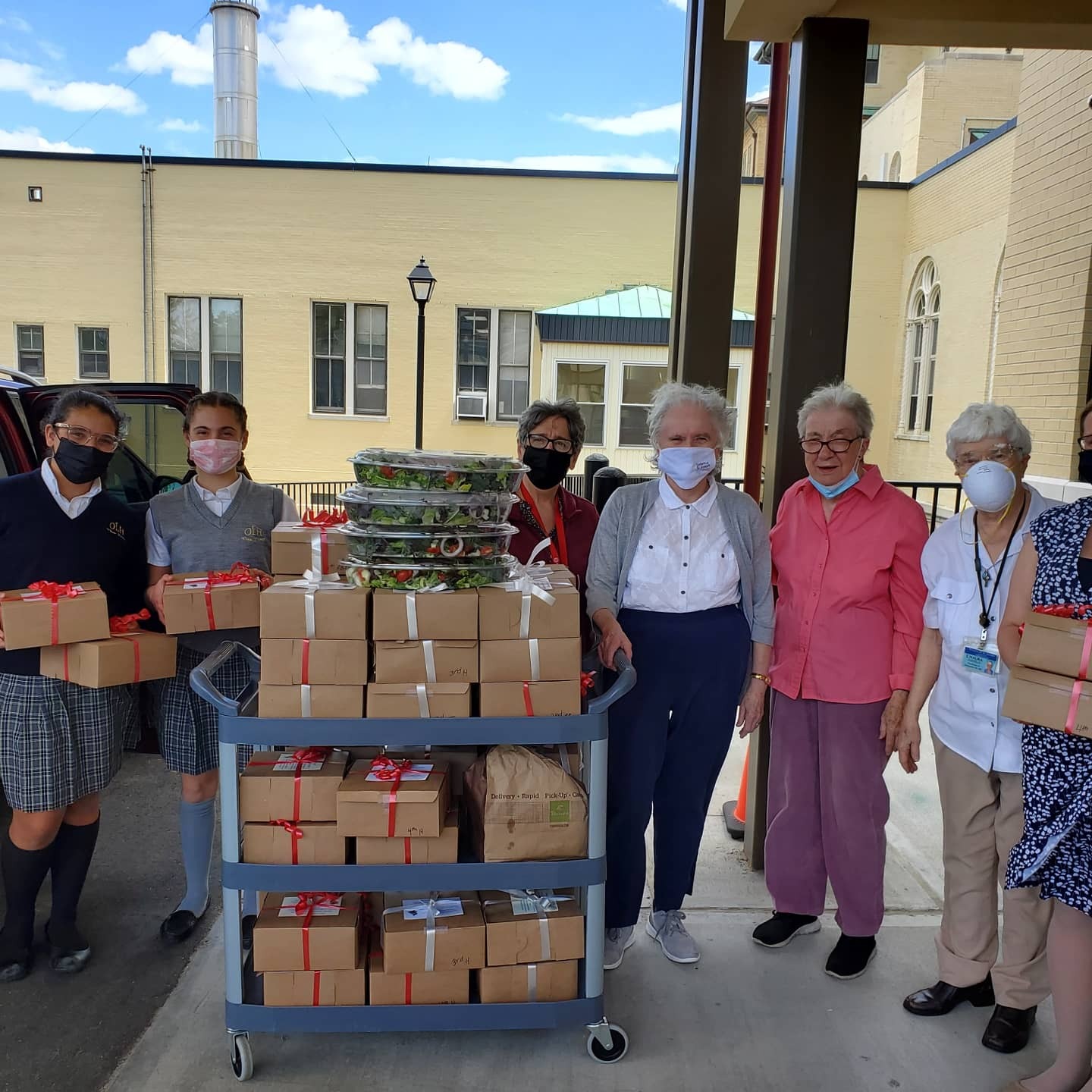 Prep 8  Maxine Boeding and Juliette Gleason delivered boxed lunches to 60 retired sisters at St. Joseph’s Convent in Brentwood as a part of the Our Lady of the Hamptons Senior Luncheon.