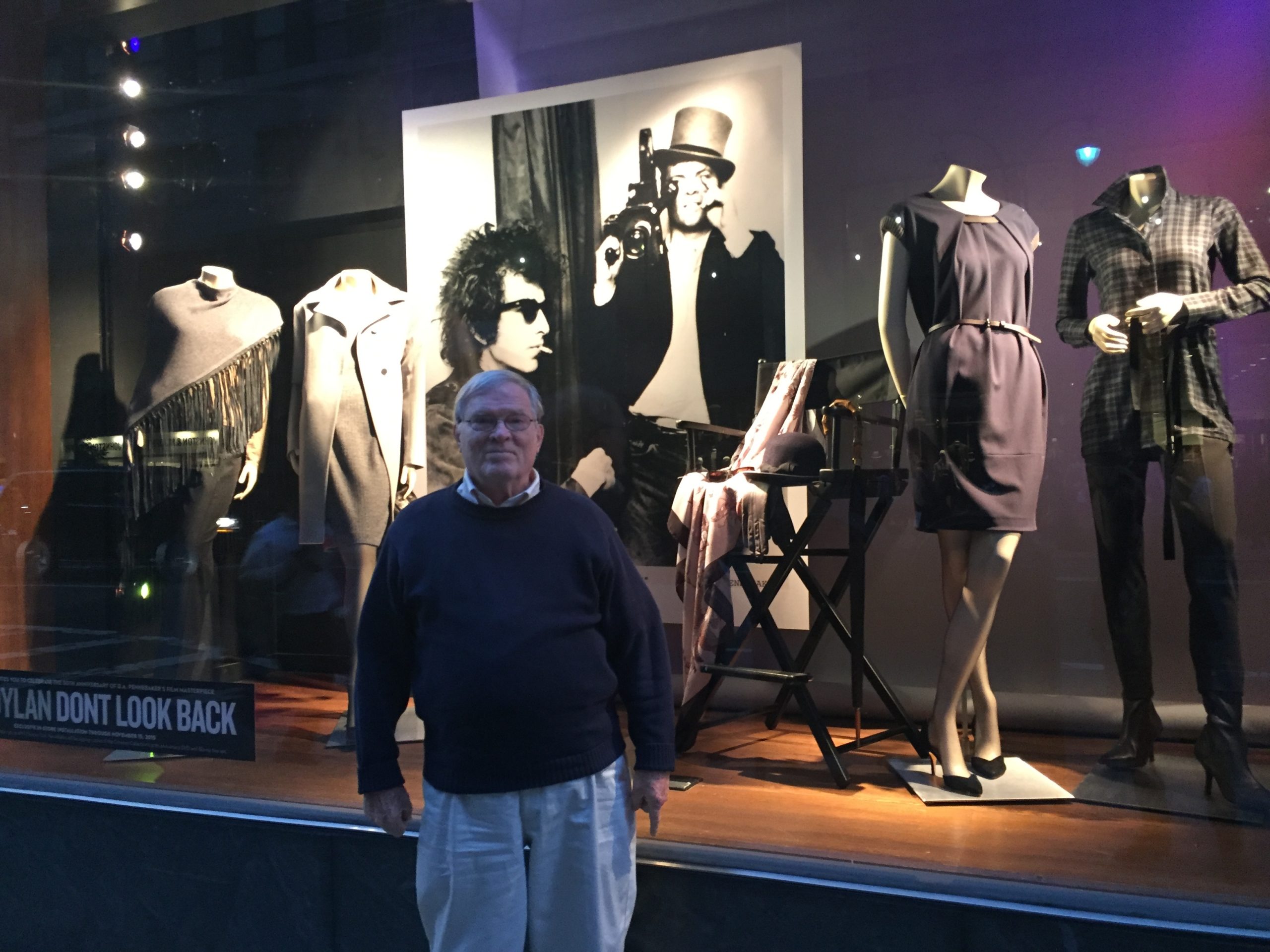 D.A. Pennebaker in front of the Paul Stuart store window on Madison Ave featuring Joseph's Baldassare's first Bob Dylan photo exhibition. installed