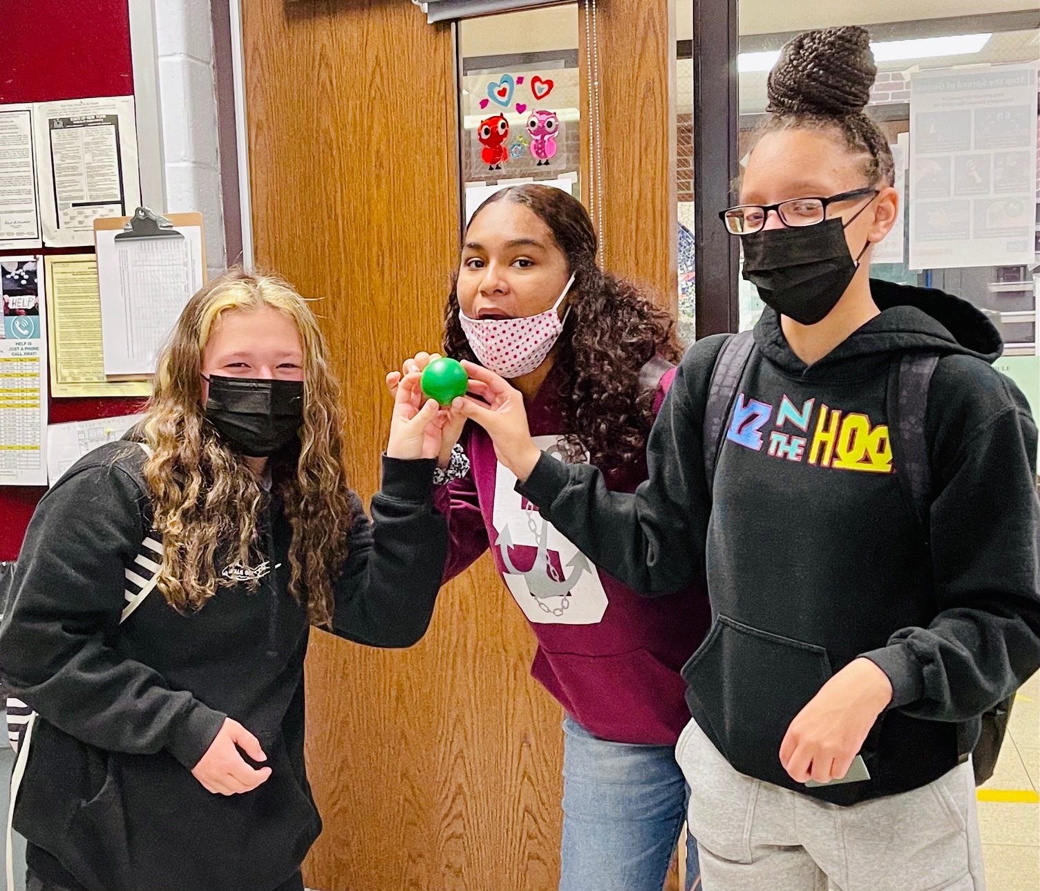 Chloe Phillips, Carine Franklin and Amadyah Palmore hold stress balls used in the scavenger hunt promoting mental health awareness at Southampton High School.