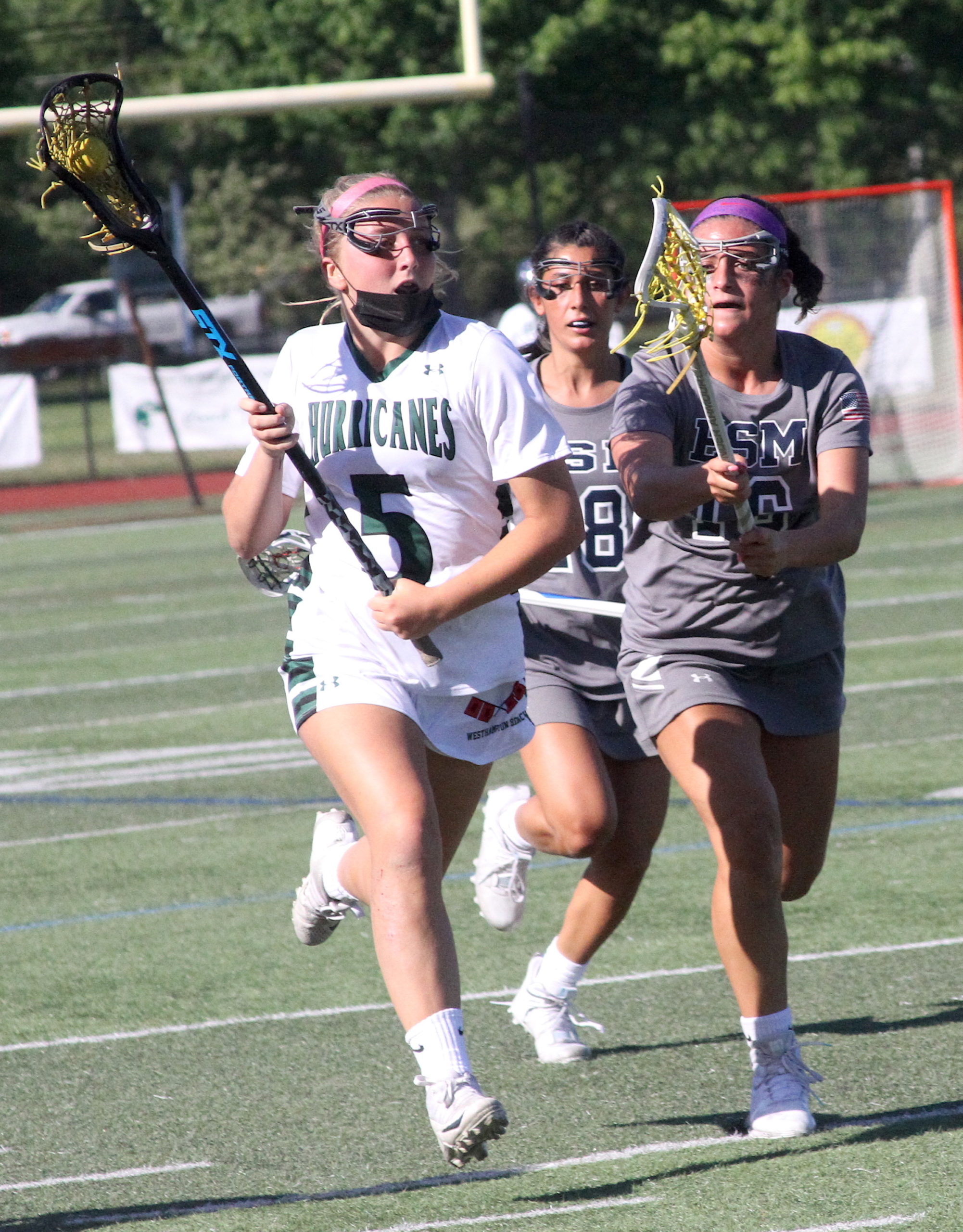 Westhampton Beach senior defender Caroline Henke carries the ball into Eastport-South Manor's zone. DESIRÉE KEEGAN