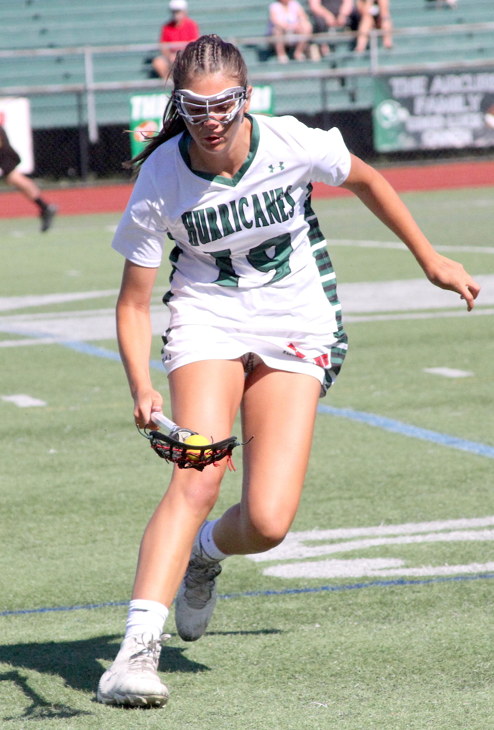 Westhampton Beach junior midfielder Olivia Rongo scoops up a ground ball after a forced turnover in the first half of the game. DESIRÉE KEEGAN