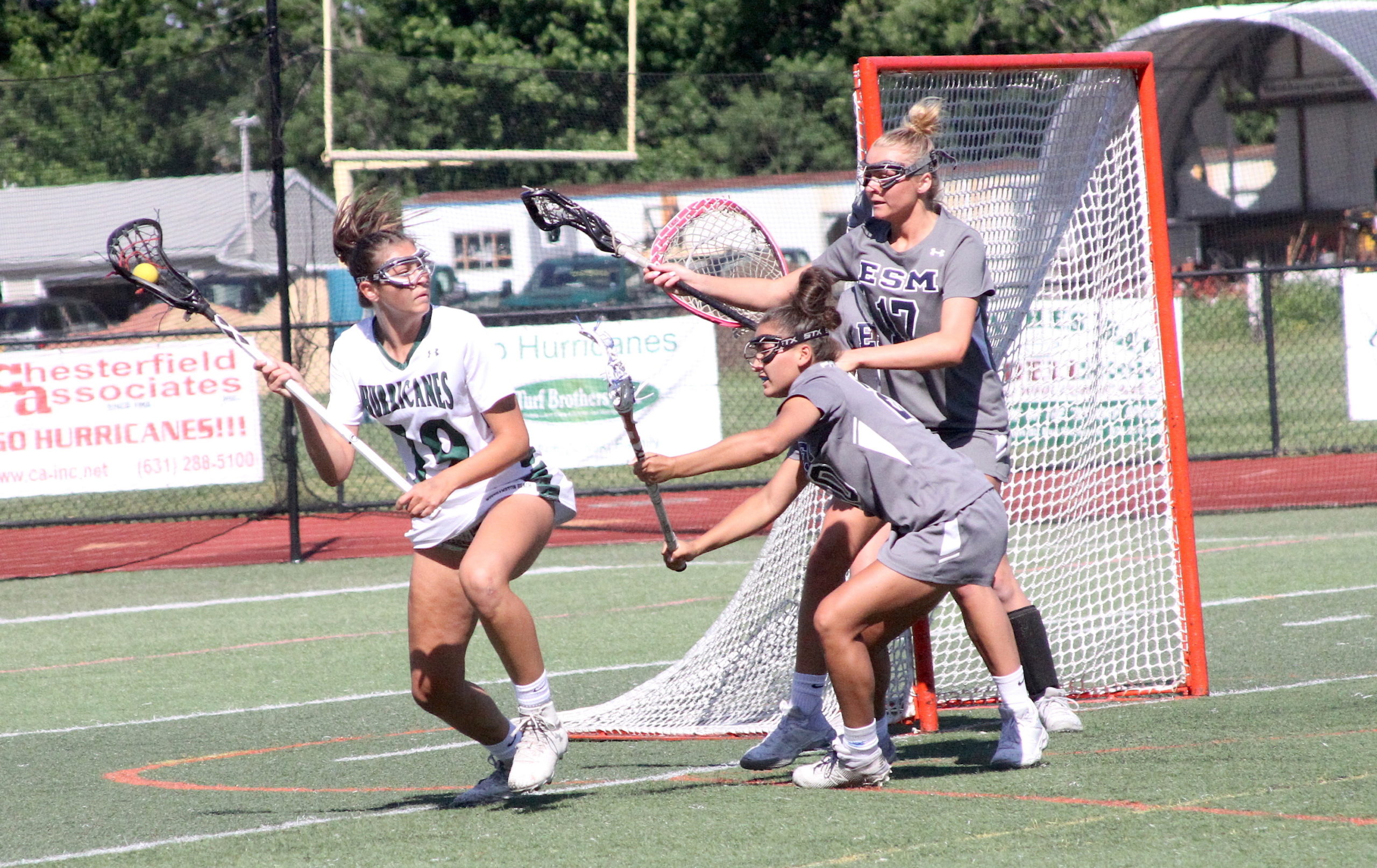 Westhampton Beach junior midfielder Olivia Rongo carries the ball around the back of the cage and looks for a teammate to feed. DESIRÉE KEEGAN