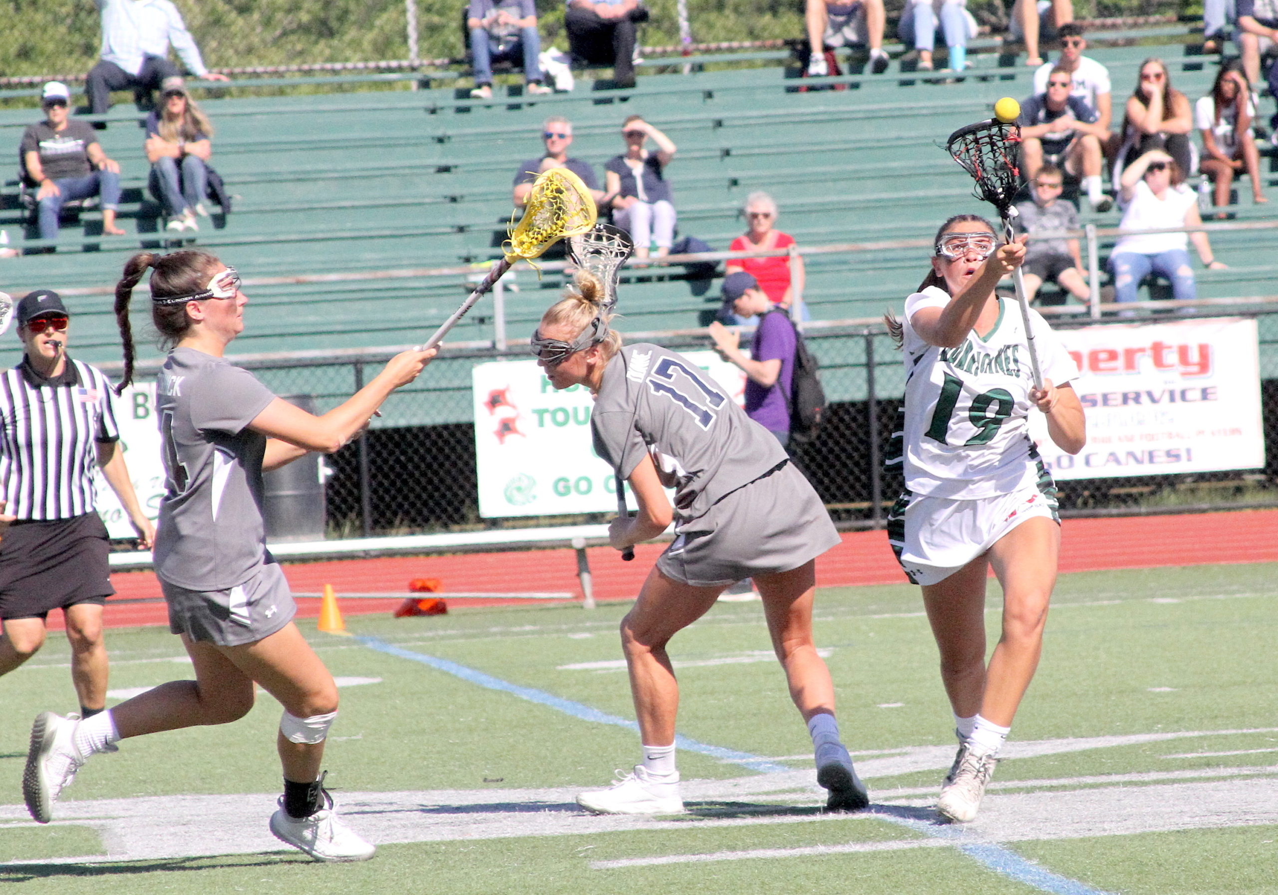 Westhampton Beach junior midfielder Olivia Rongo comes away with possession off the draw. DESIRÉE KEEGAN