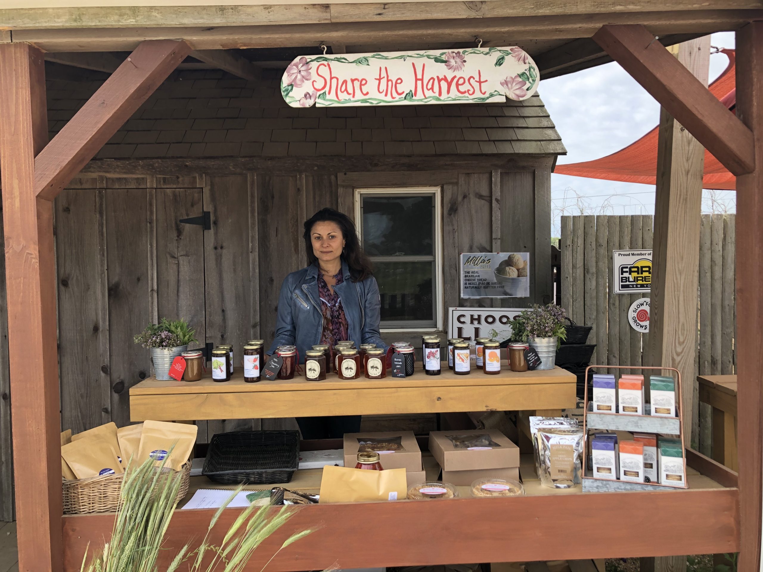 Volunteer Justine Giordano at the EECO/“Share The Harvest” farmstand, which donates 100 percent of proceeds to people in need on the East End. And that’s just one part of how they help the community.