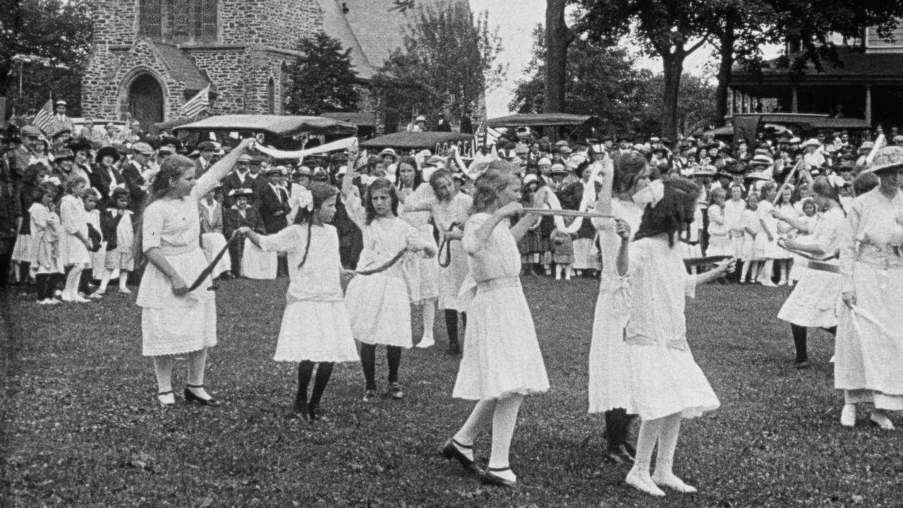 Girls dancing in front of St. Luke's Episcopal Church in Pathé News newsreel of East Hampton’s 1915 Fourth of July parade.