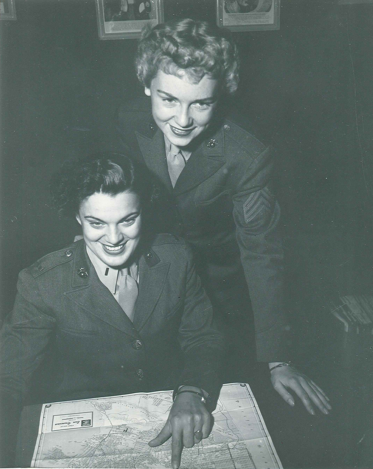 Sgt. Evelyn Kandel, right, poses for a recruitment ad for the U.S. Marine Corps Women's Reserve. She did not get to keep the uniform after the photo was taken, but was presented with one on June 15.      UNITED STATES MARINES