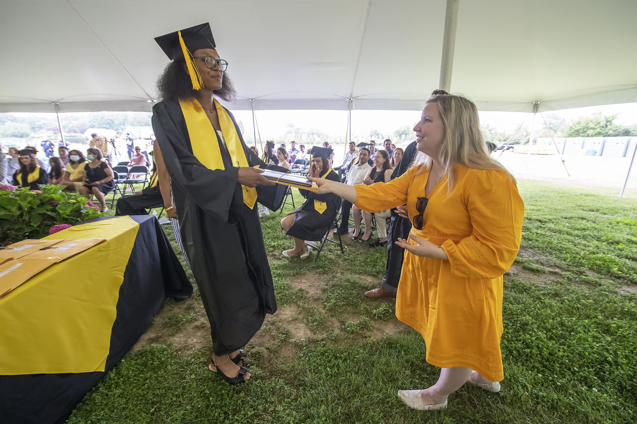 Bridgehampton School Class of 2021 senior Gylia Dryden gets her diploma during the school's 2021 commencement ceremony on Saturday.    MICHAEL HELLER