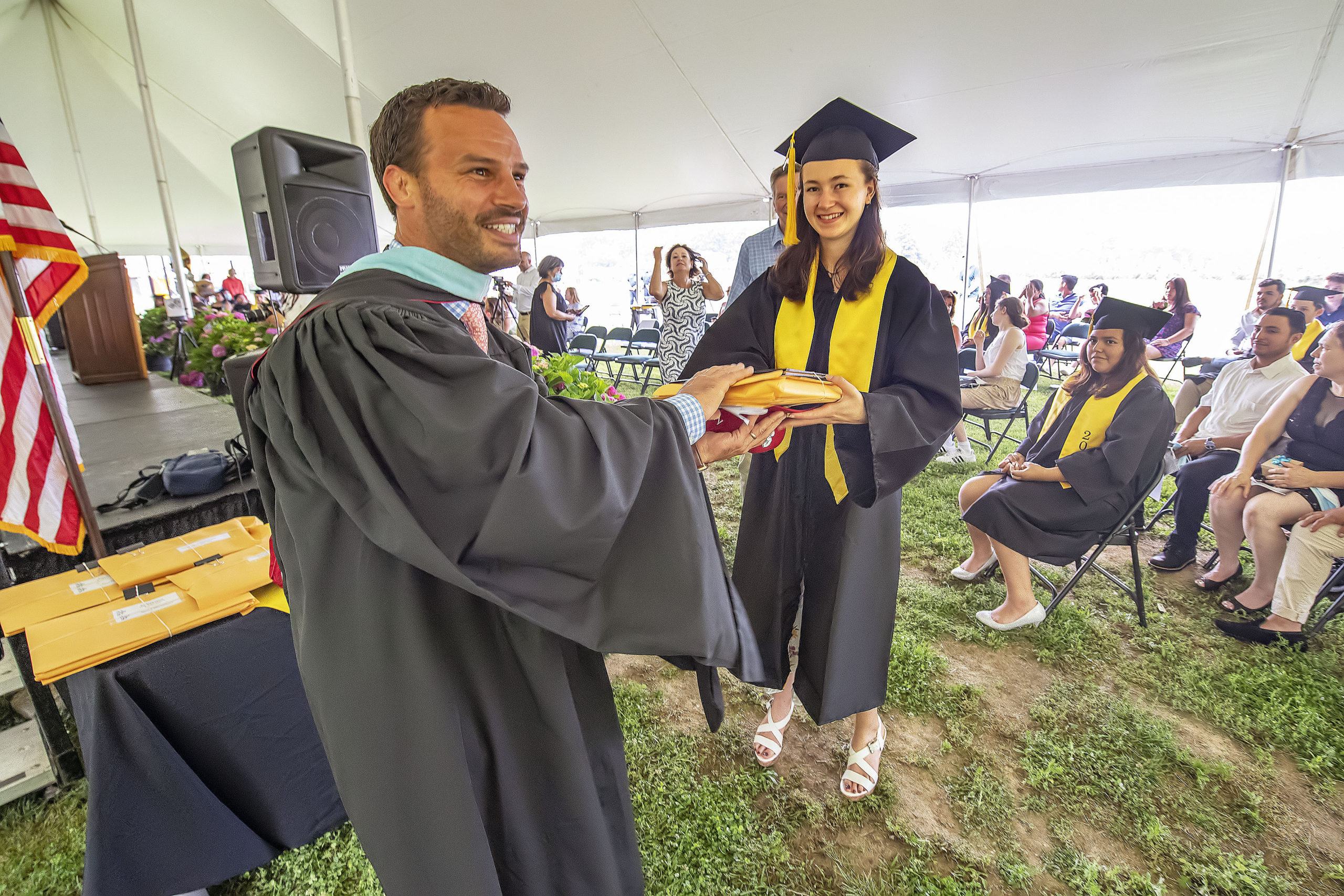 Bridgehampton School Class of 2021 senior Zoe Lucas gets her diploma from Assistant Principal Michael Cox during the school's 2021 commencement ceremony on Saturday.   MICHAEL HELLER