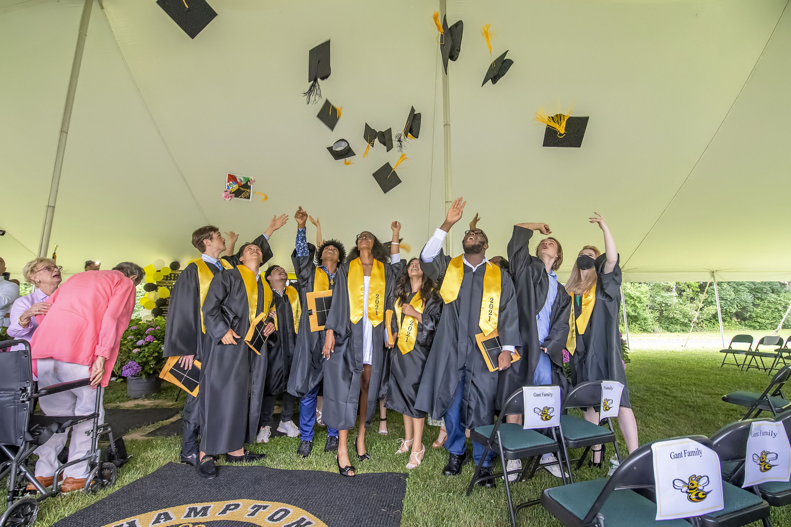 The Bridgehampton School Class of 2021 throws their caps into the air following the school's 2021 commencement ceremony on Saturday.    MICHAEL HELLER