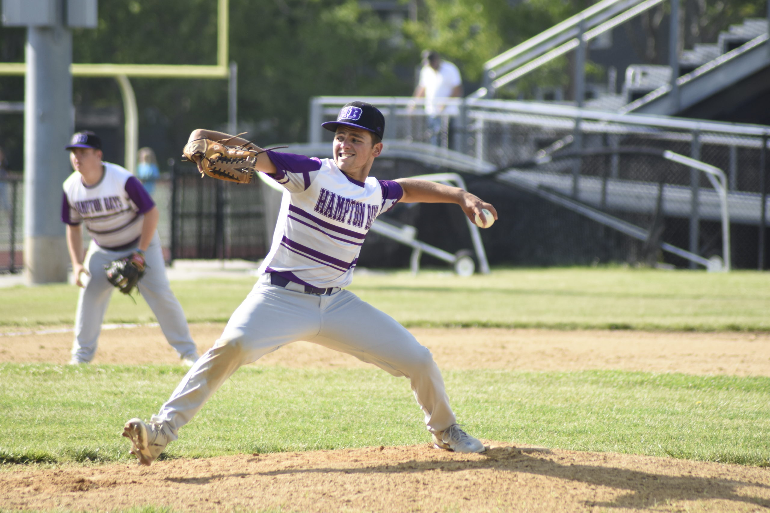 Hampton Bays senior Jordan Adelson delivers a pitch to the plate during Friday's blowout victory.