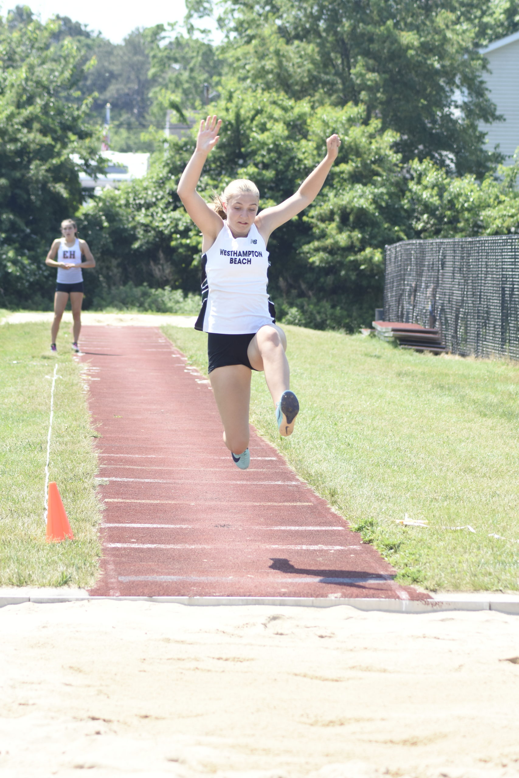 Westhampton Beach freshman Madison Phillips competing in the long jump portion of the pentathlon on June 6.