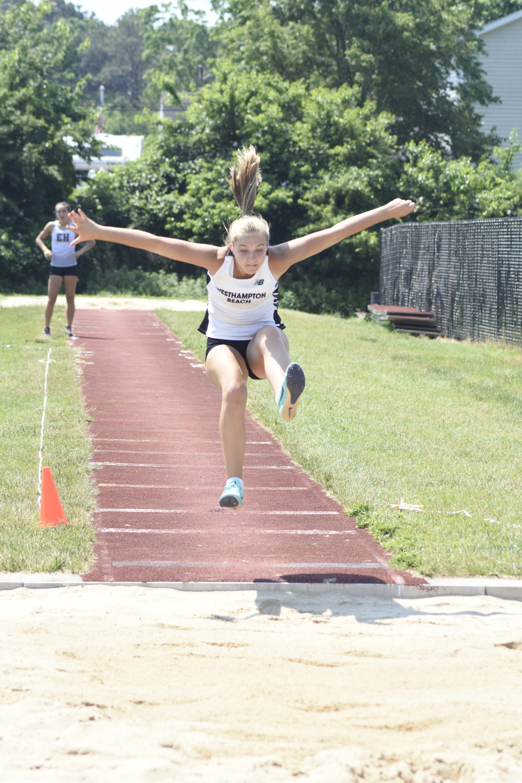 Westhampton Beach freshman Madison Phillips competing in the long jump portion of the pentathlon on June 6.