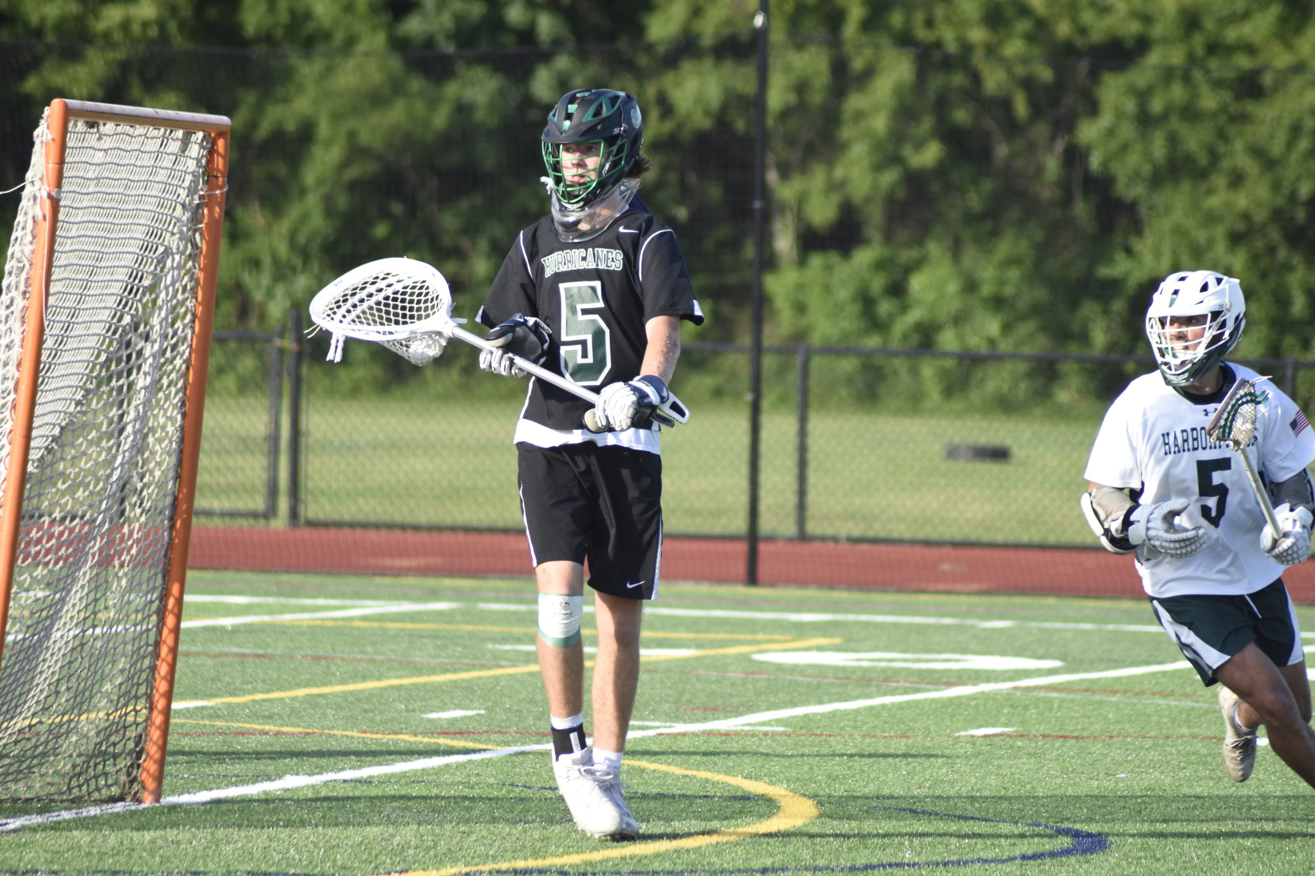 Westhampton Beach goalie Conor Farnan looks for an open player to pass to.
