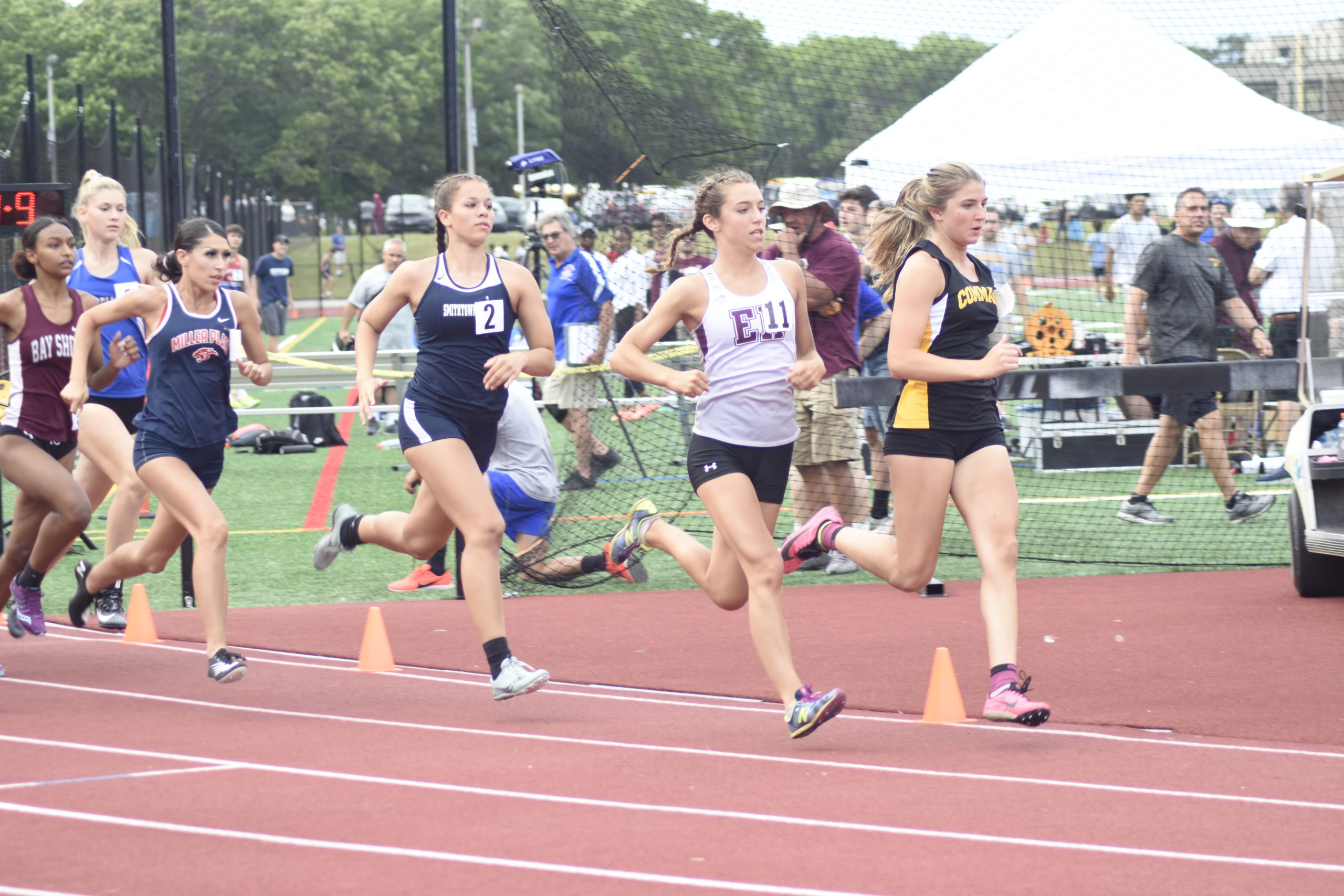 East Hampton senior Bella Tarbet darts over to the head of the pack at the start of the 800-meter run portion of the pentathlon.