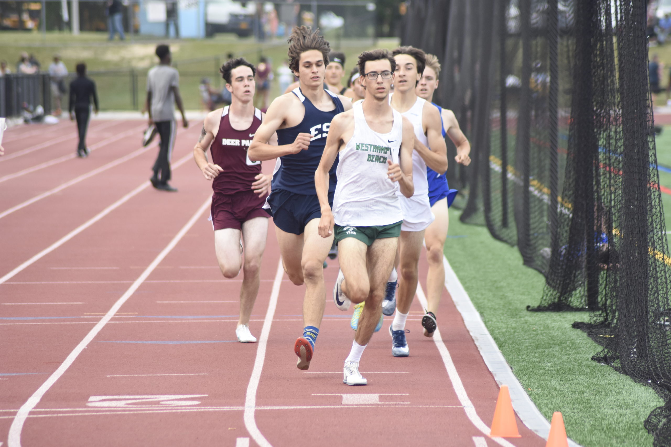 Westhampton Beach junior Gavin Ehlers had to fend off Eastport-South Manor senior Michael Silveri for the county title in the 1,600-meter race on Friday.