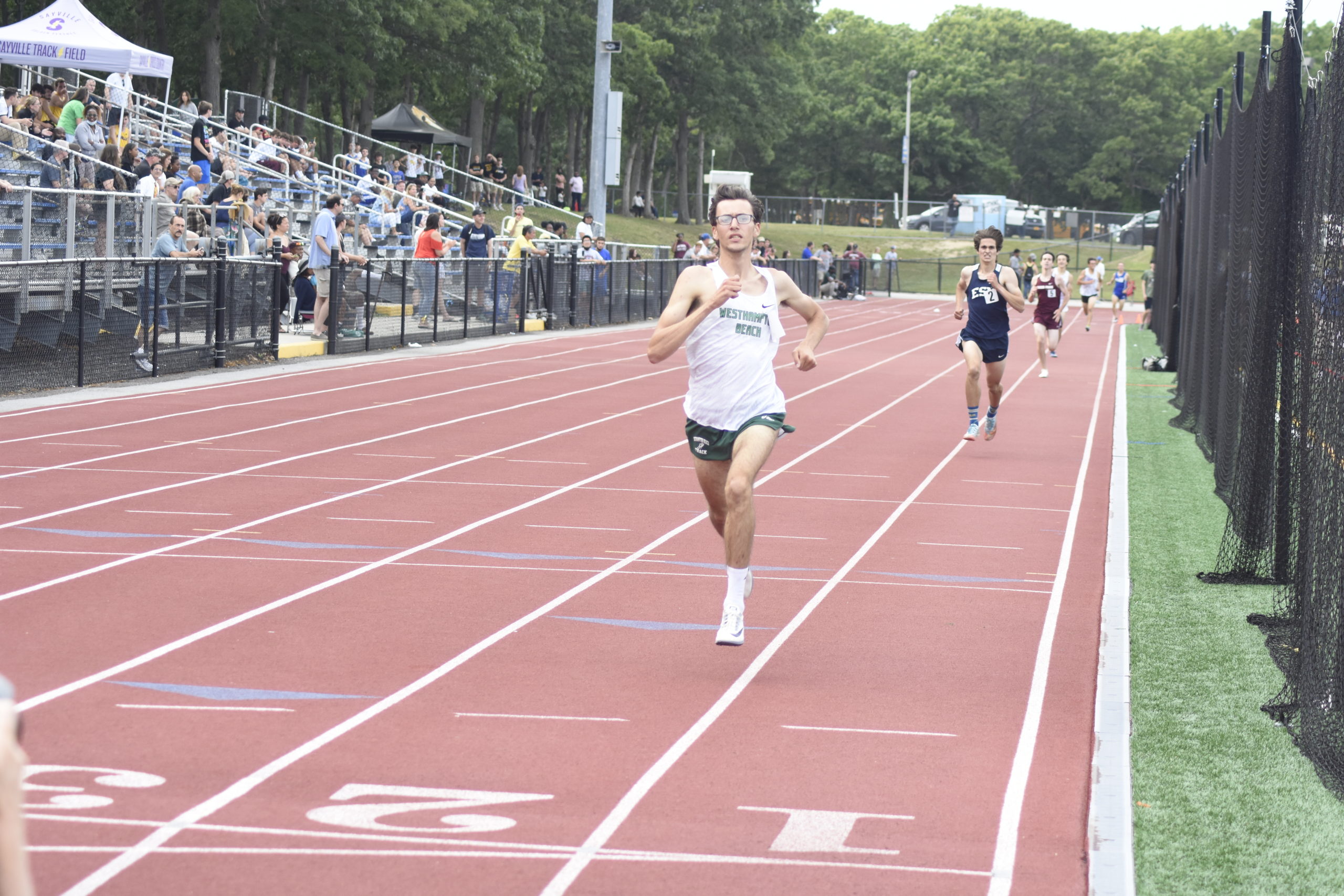 Junior Hurricane Gavin Ehlers crosses the finish line first in the 1,600-meter race to become county champion.