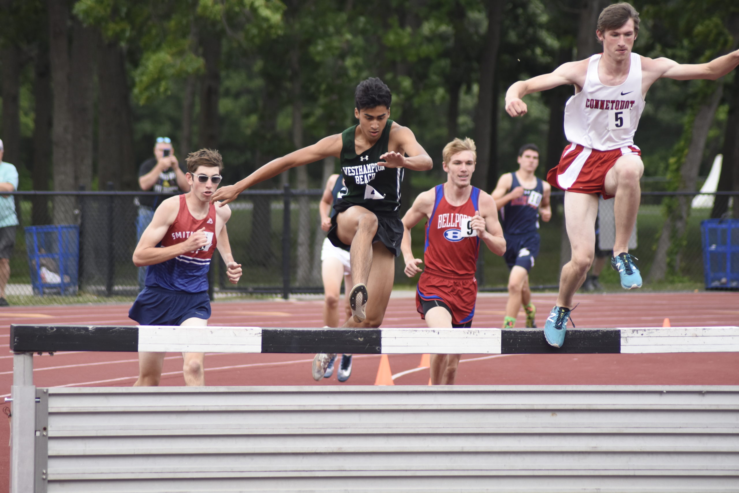 Westhampton Beach junior David Alvarado gets set to make his way into the water pit of the 3,000-meter steeplechase.