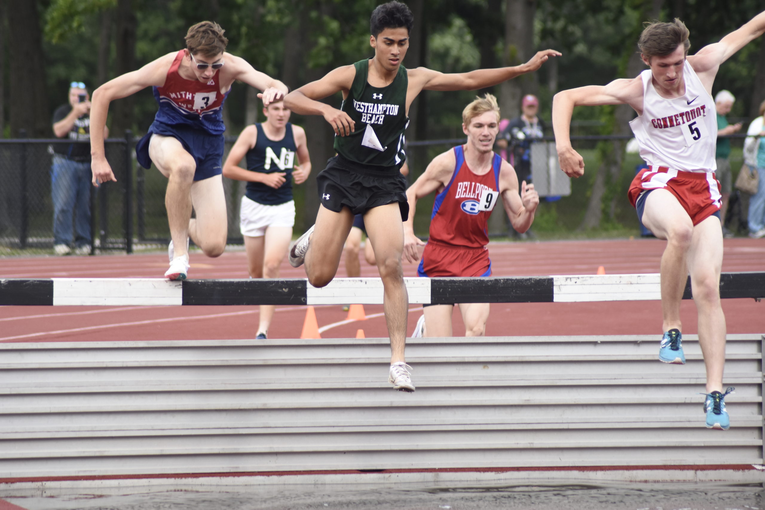 Westhampton Beach junior David Alvarado gets set to make his way into the water pit of the 3,000-meter steeplechase.