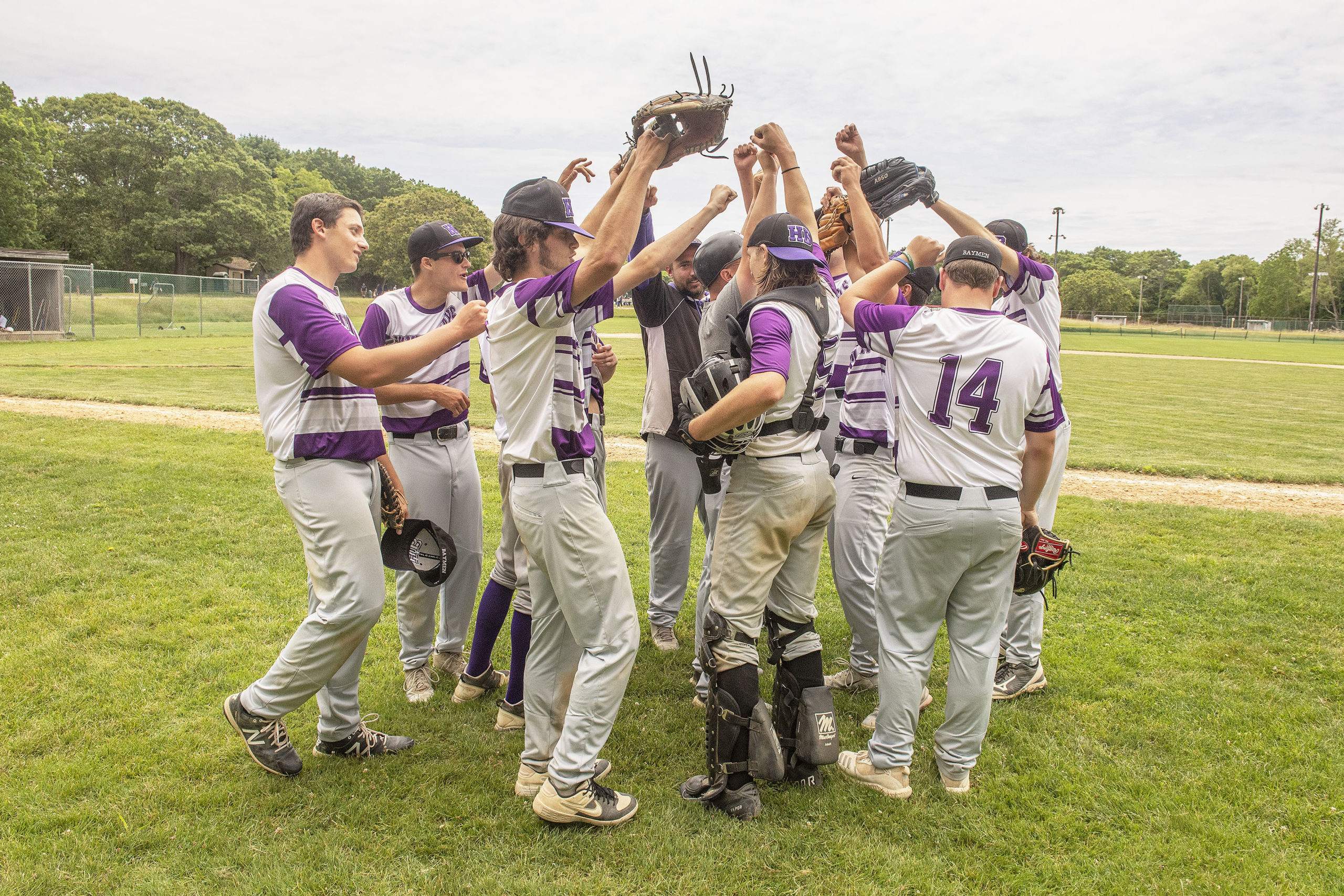 The Baymen celebrate after their 9-5 victory over Pierson on Saturday.