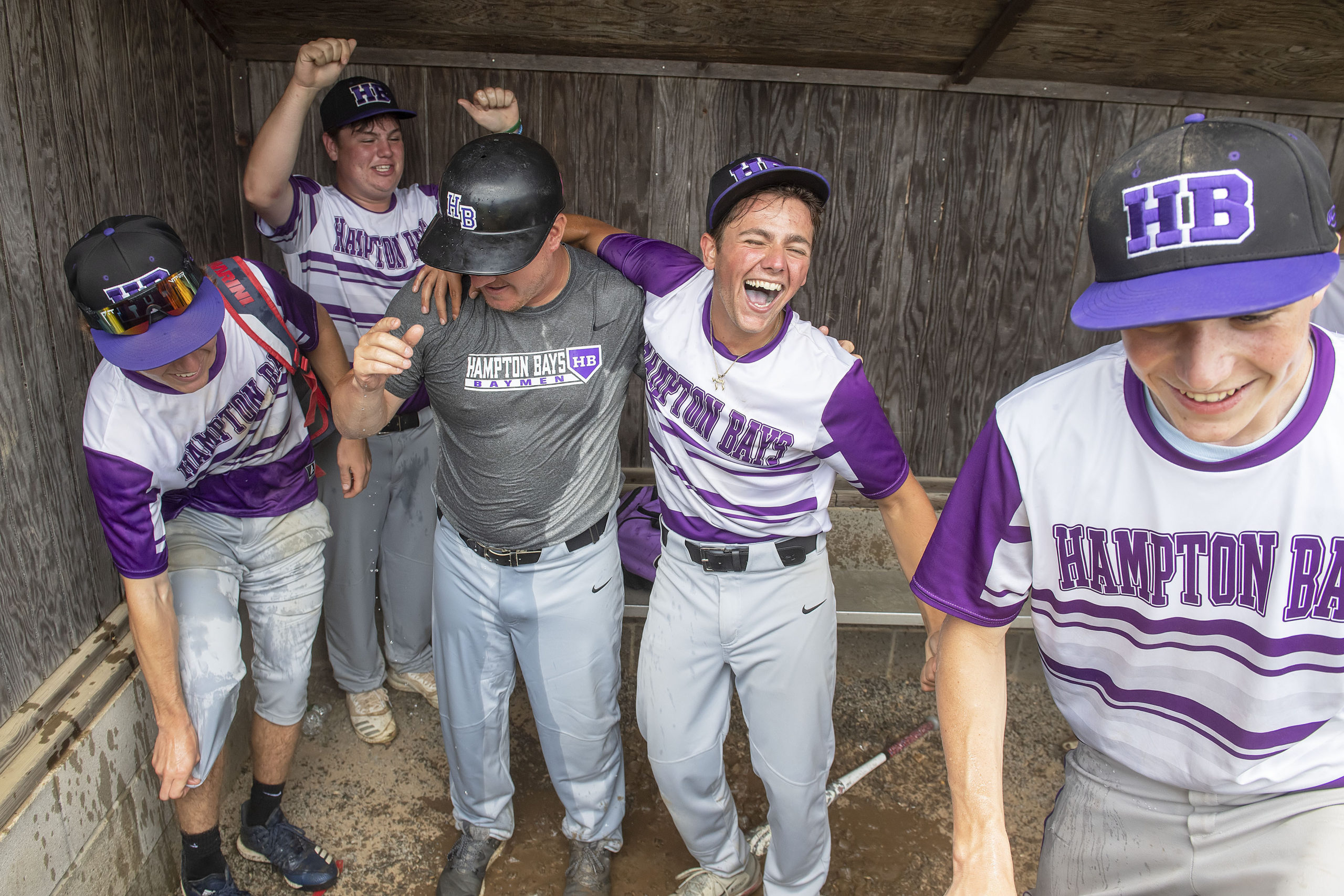 The Baymen celebrated by pouring a cooler of ice water over head coach John Foster after they defeated previously unbeaten Pierson at Mashashimuet Park in Sag Harbor on Saturday.