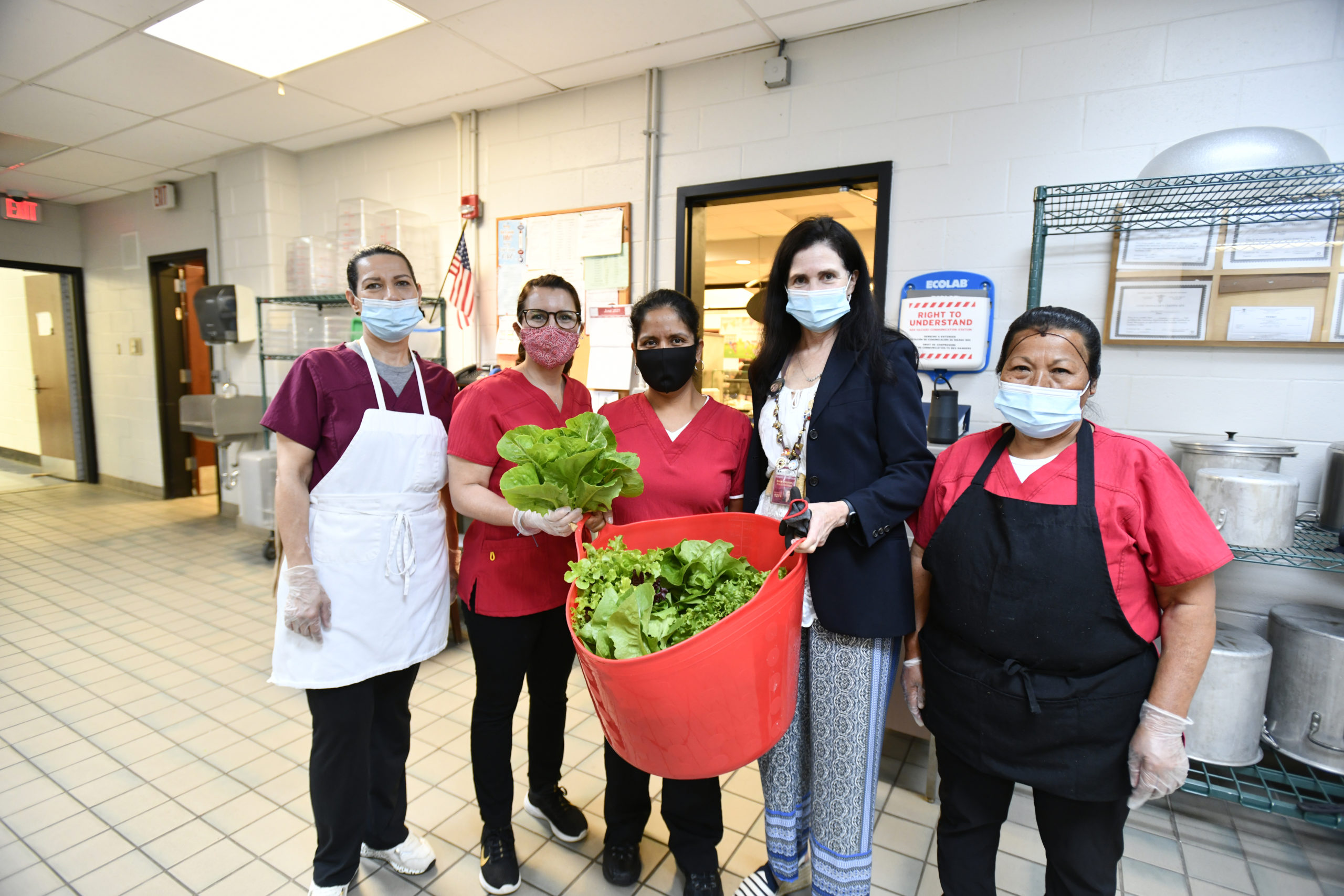 Regan Kiembock, third from left  in the Southampton High School kitchen with Luz Gonzales, Katty Murillo, Maria Rojas and Connie Pinula.  DANA SHAW