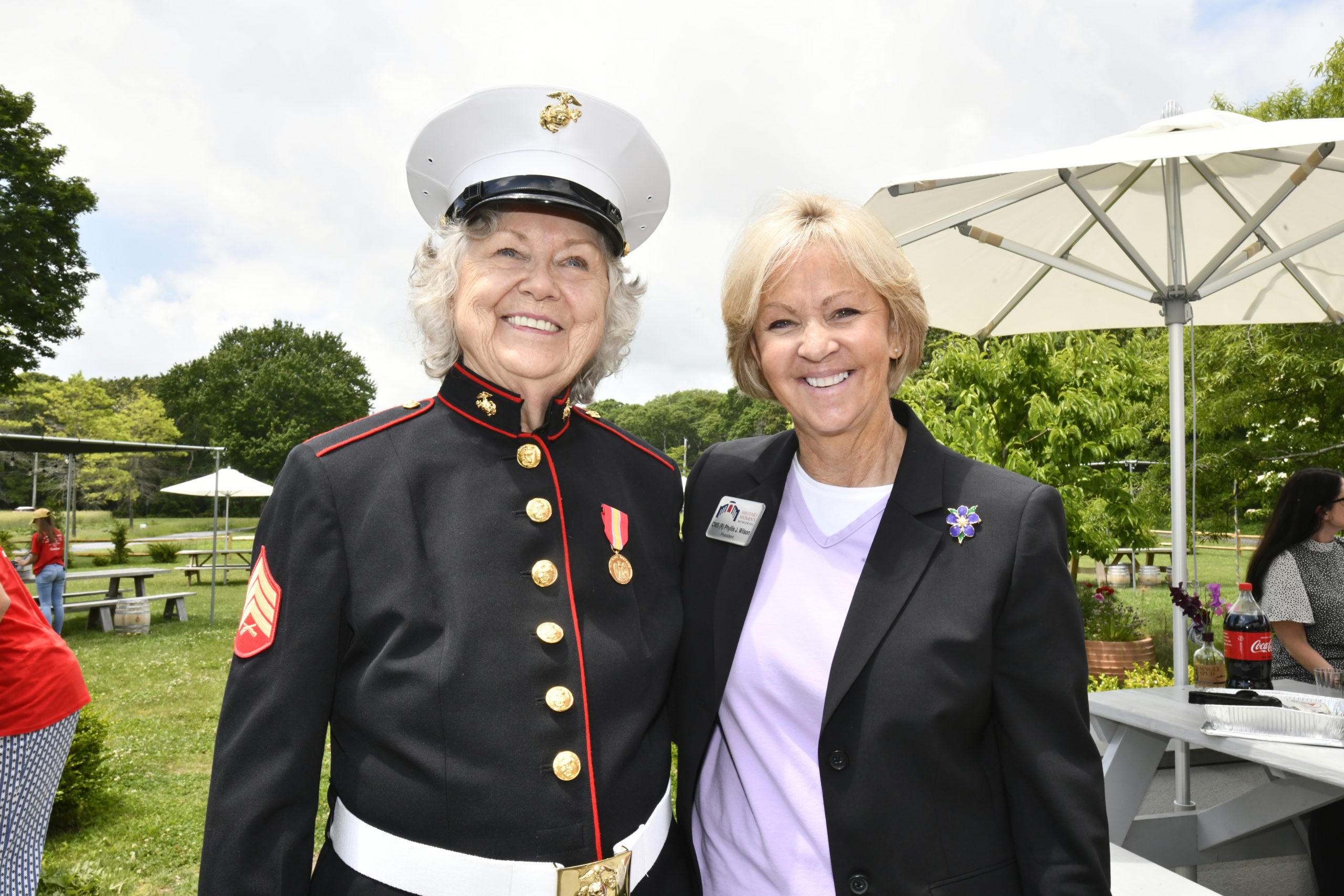 Sgt. Evelyn Kandel, left, and Phillis J. Wilson, President of the Women in Military Service for American Foundation at Sagaponack Distillery on June 15. Sgt. Kandel, of Glen Cove, served in the  U.S. Marine Corps Women’s Reserve during the Korean War from 1951 to 1953. During her time serving, Sgt. Kandel was asked to pose for recruiting materials for the U.S. Marine Corps Women’s Reserve. She was given a uniform to wear for the photographs, but the Marines took it back afterward. Honor Flight Long Island and Col. Frank Tauches, U.S. Marine Corps, retired made sure that Sgt. Kandel finally got the uniform she earned and a ceremony honoring her and her service.  Sgt. Kandel is also Poet Laureate of Nassau County.  DANA SHAW