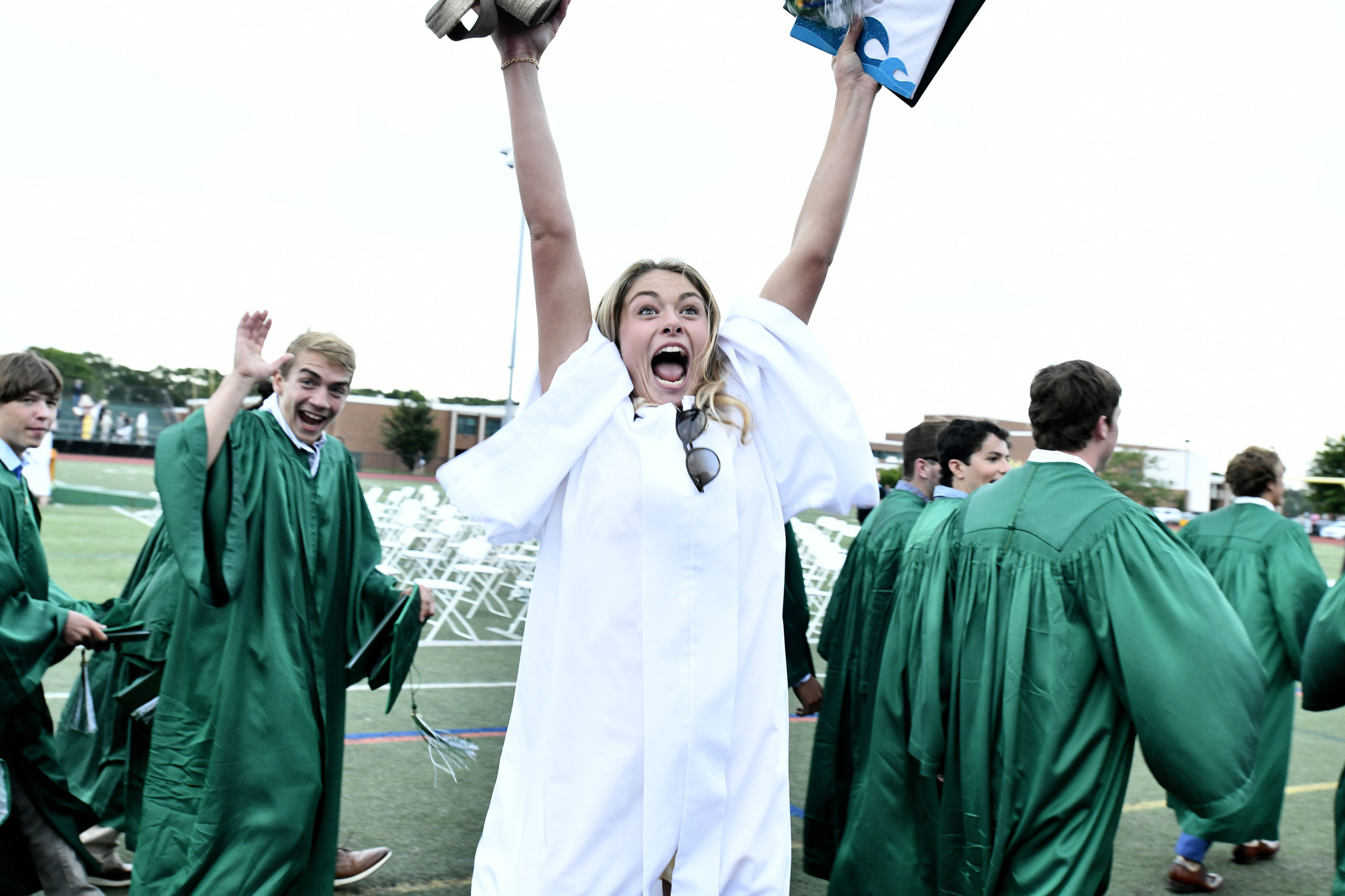 Ella Dunathan celebrates after receiving her diploma.  DANA SHAW