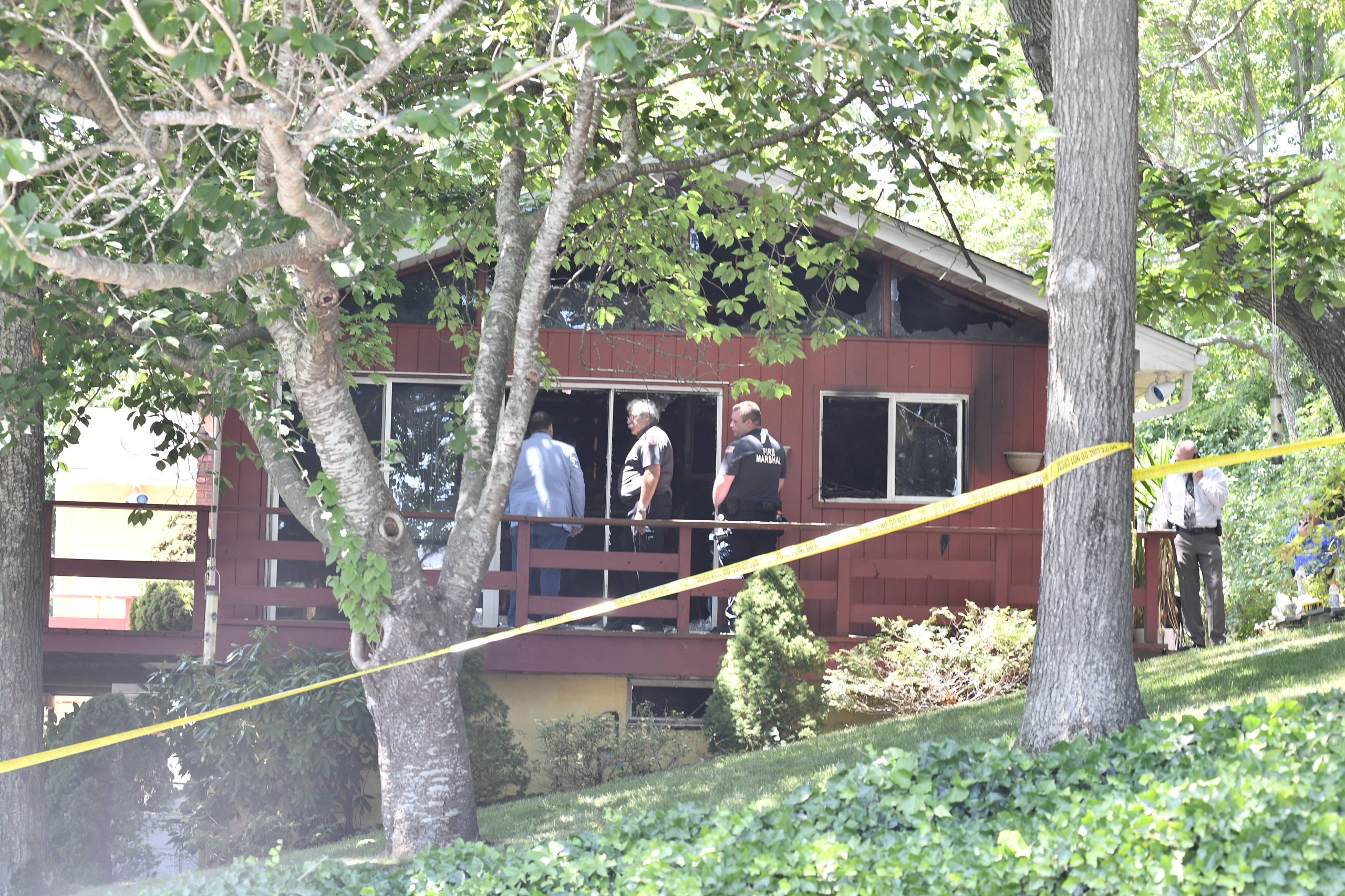 Investigators are currently on the scene of a fatal house fire on Mildred Place in Hampton Bays.  DANA SHAW