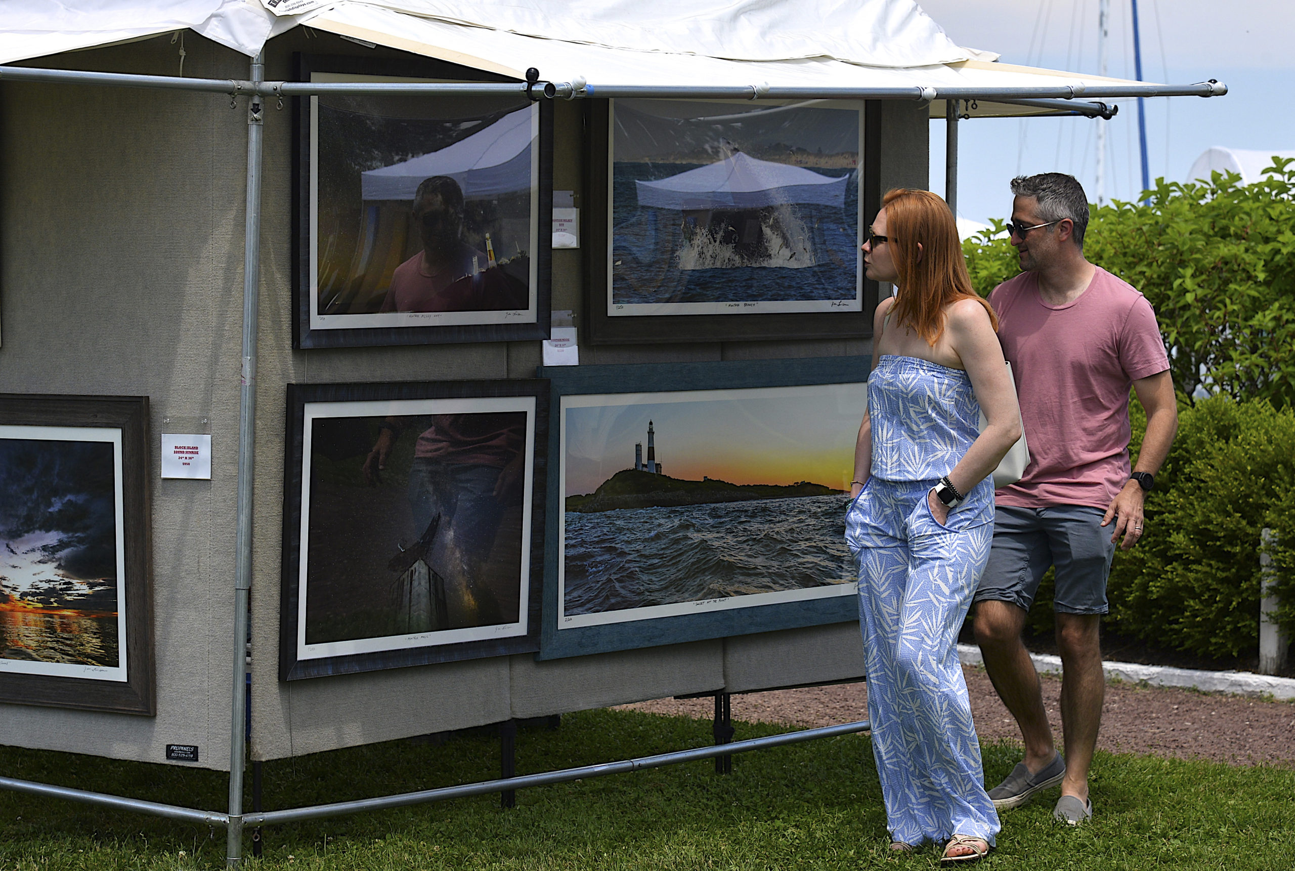 Visitors browse at the Sag Harbor Arts and Crafts Fair in Marine Park on Saturday.     KYRIL BROMLEY