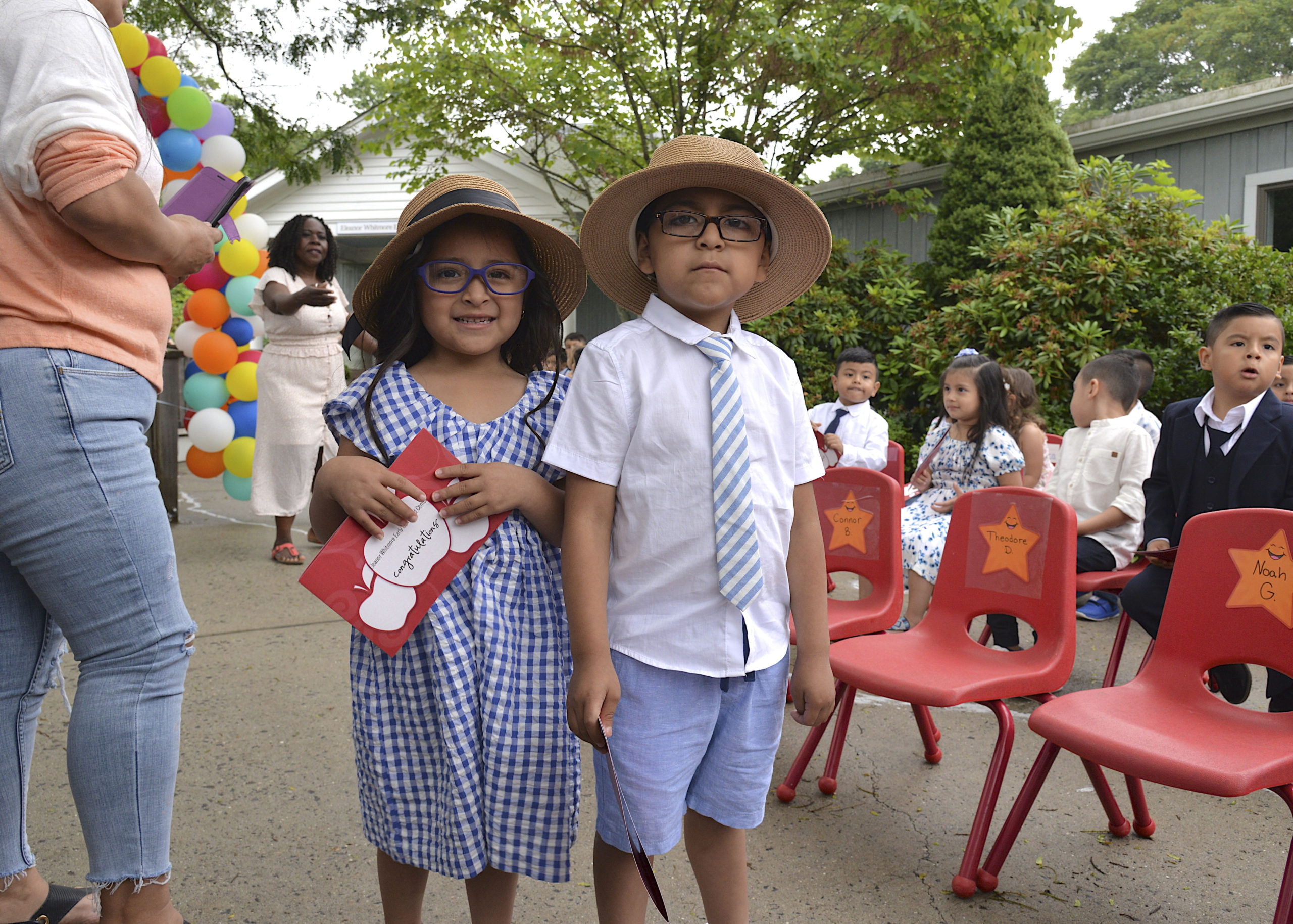 Valeria and Axel Yaguarem at the Eleanor Whitmore Early Childhood Center's  Pre-K moving up ceremony on Friday for the more than 40 children who will celebrate their official entry into Kindergarten.   KYRIL BROIMLEY
