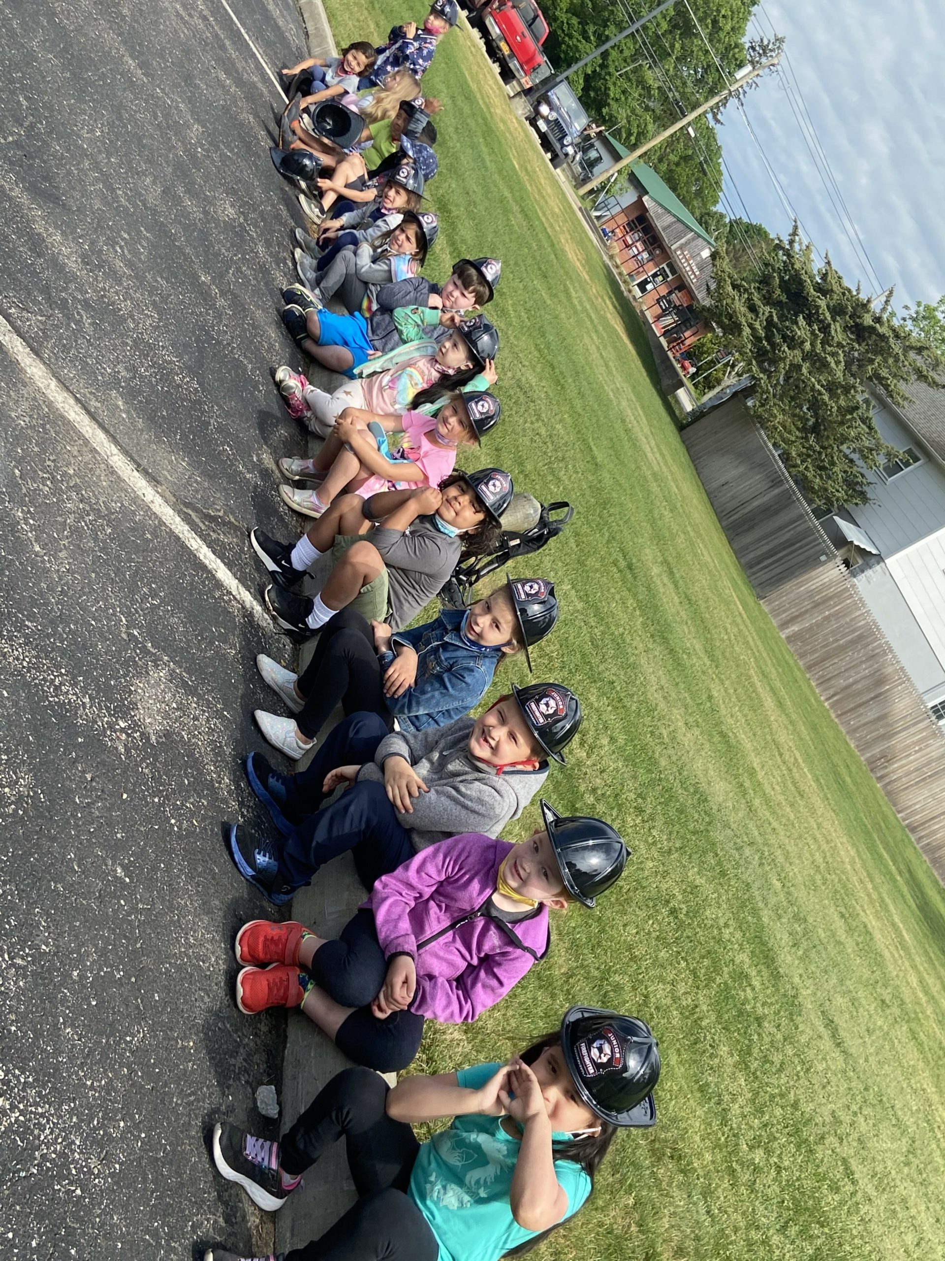 Kindergarten students from East Quogue Elementary School walked to the East Quogue Fire Department station to learn about local volunteers and fire safety. Students explored the different fire trucks, ambulances and had a turn shooting the fire hose.