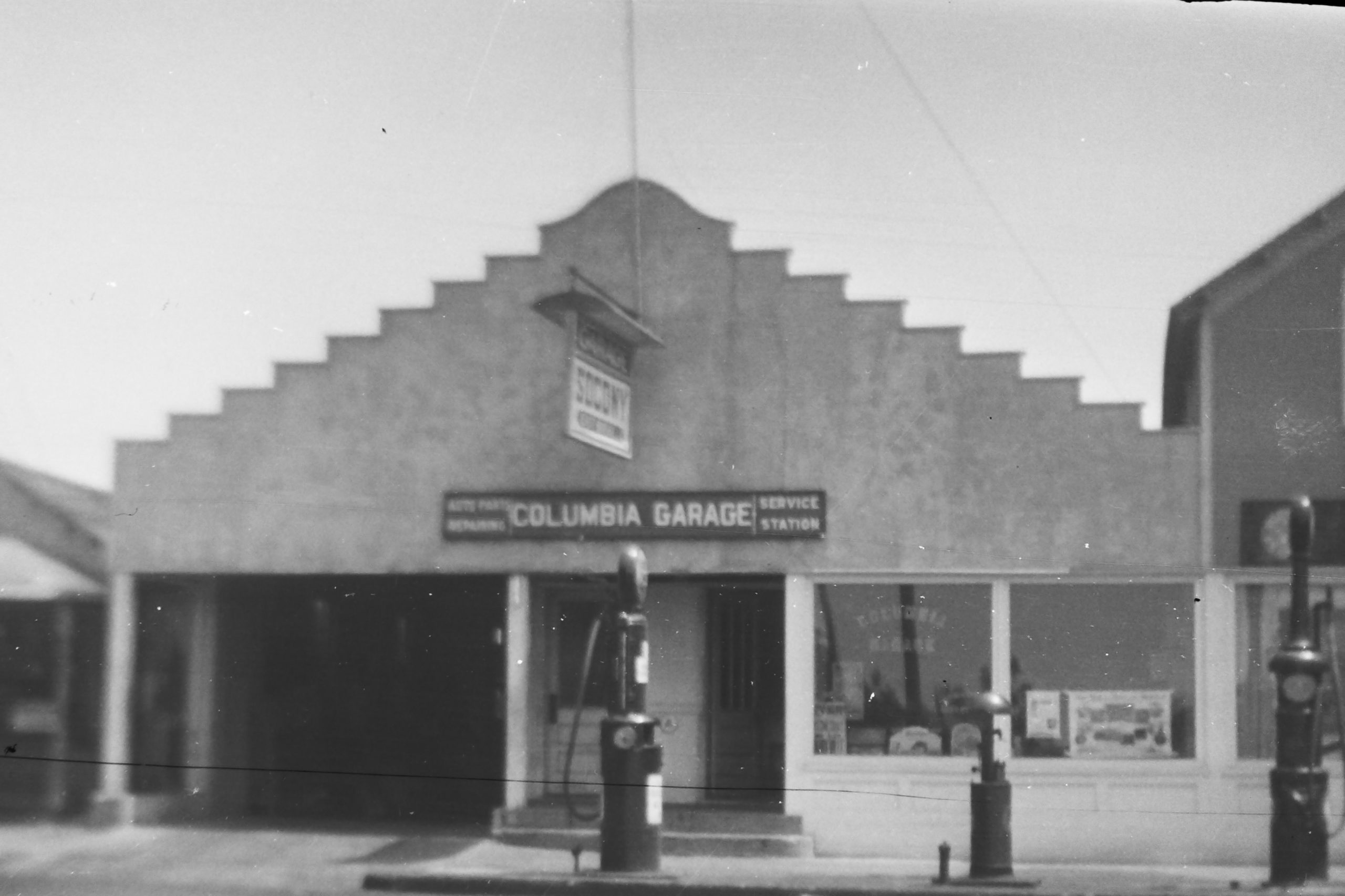 The facade of what was once Columbia Garage still exists today as Village Prime Meat Shoppe and Martin's Design & Construction Consultants.