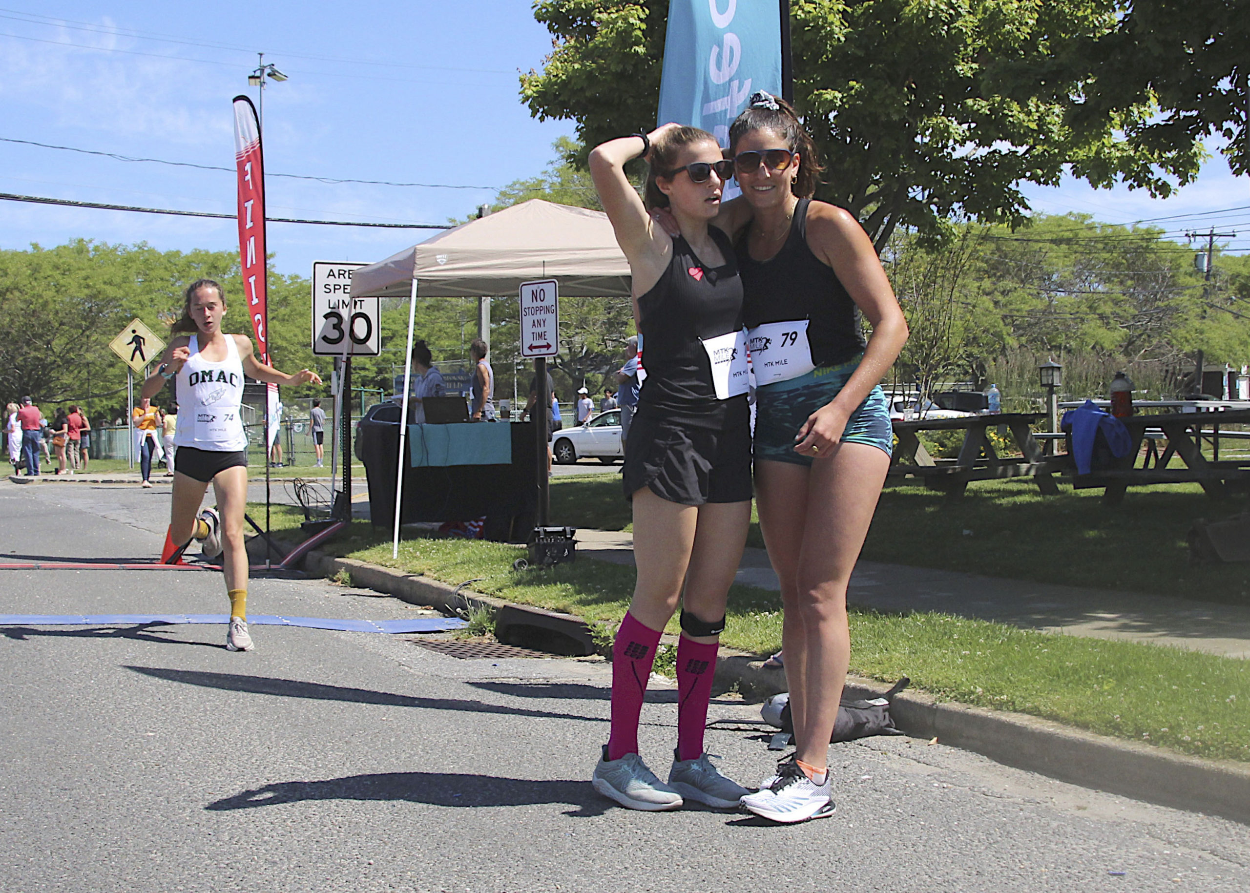 Sisters Olivia and Paige Duca, the second and first place winners of the women's race.   KYRIL BROMLEY