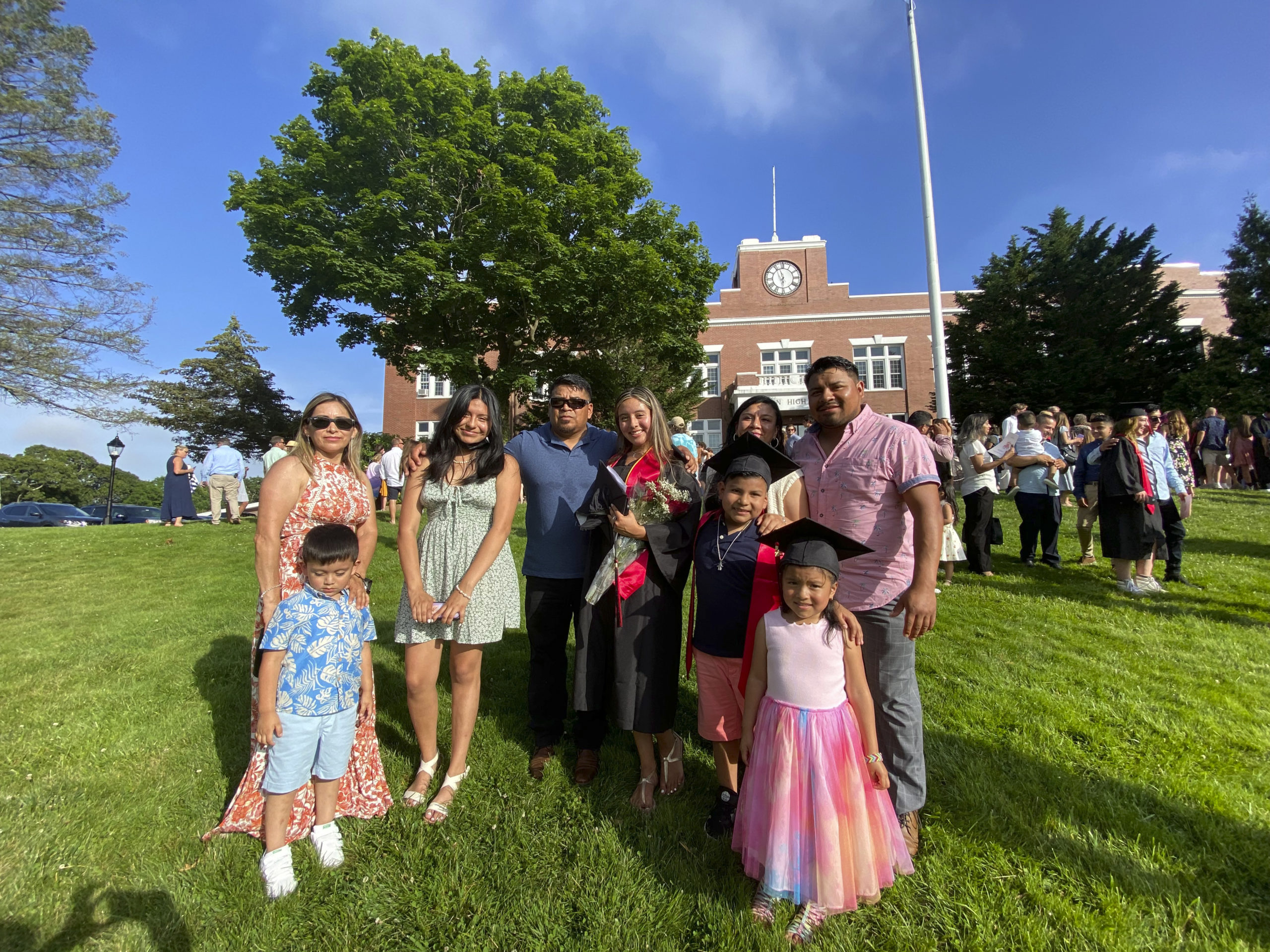 Graduate Emily Guanga, center with her family.  DANA SHAW