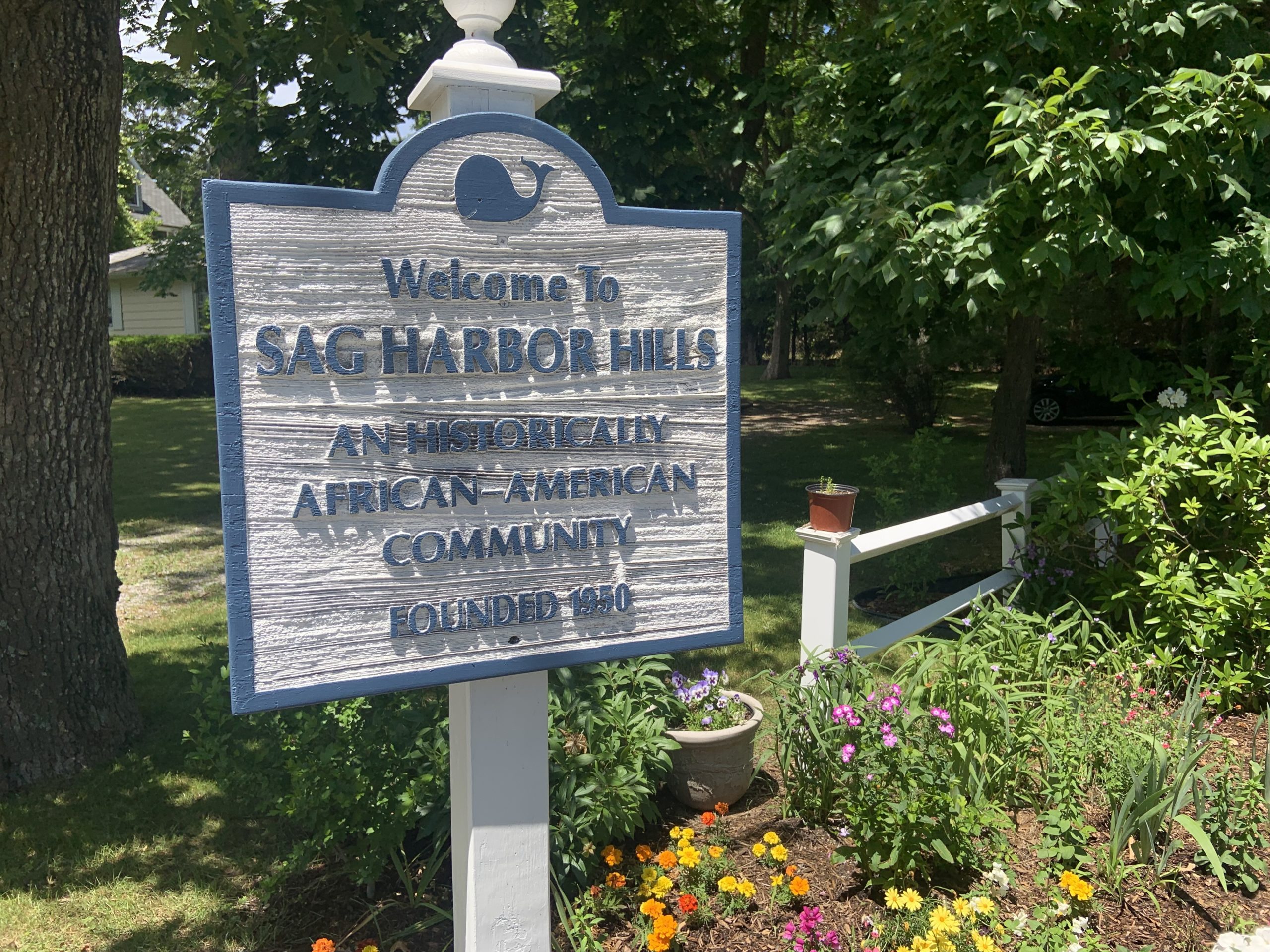 A sign at the entrance to the Sag Harbor Hills neighborhood in Sag Harbor refers to its history as an African American community. STEPHEN J. KOTZ